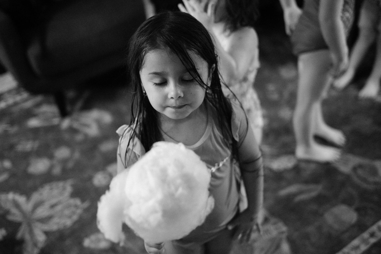 Black and white photographs capturing candid childhood moments.