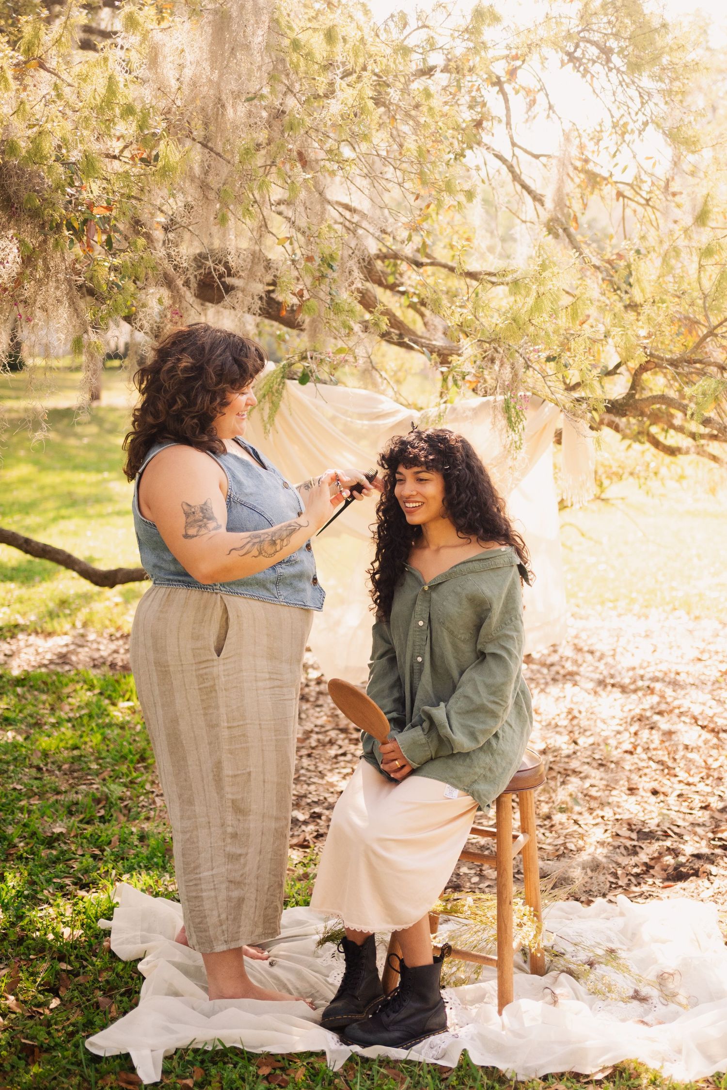 Intimate portrait session on a blanket with vintage-inspired styling and natural lighting.