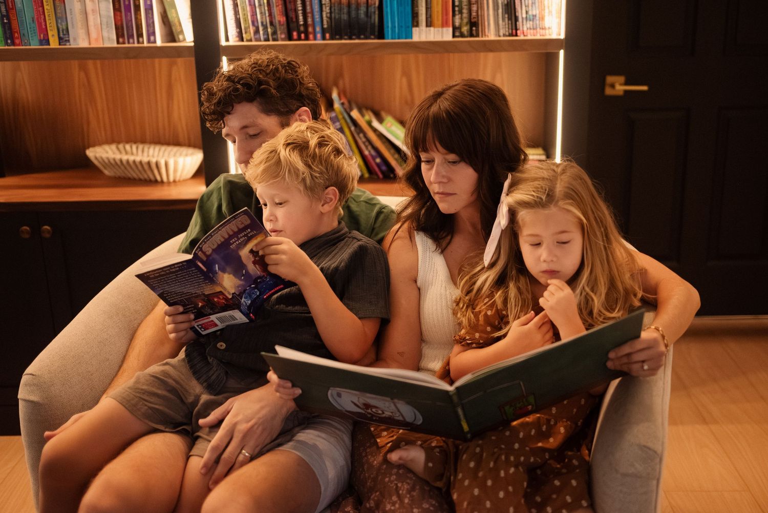 People gathered for a relaxing reading session against a backdrop of filled bookshelves.