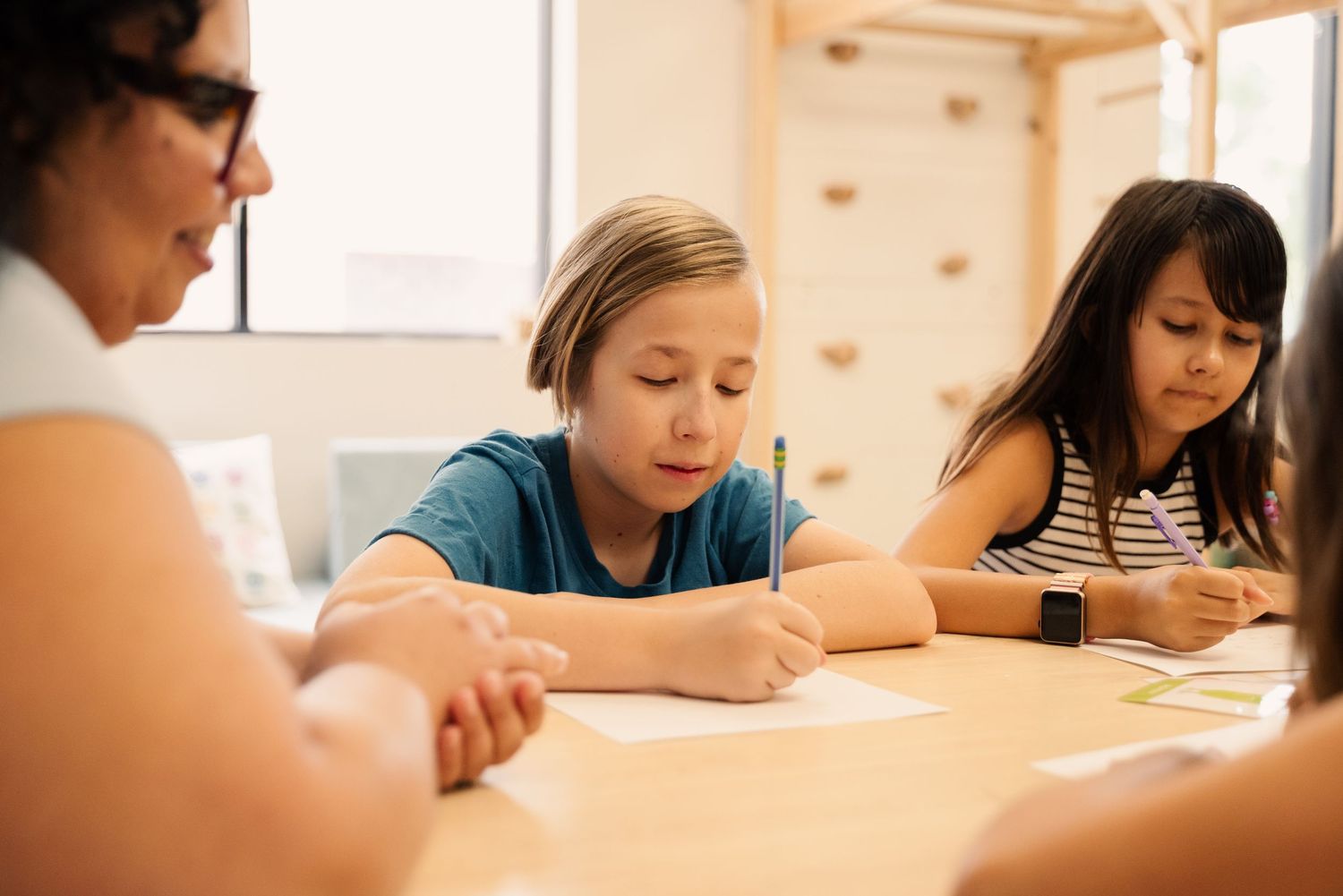 Students focused on writing during an educational activity.