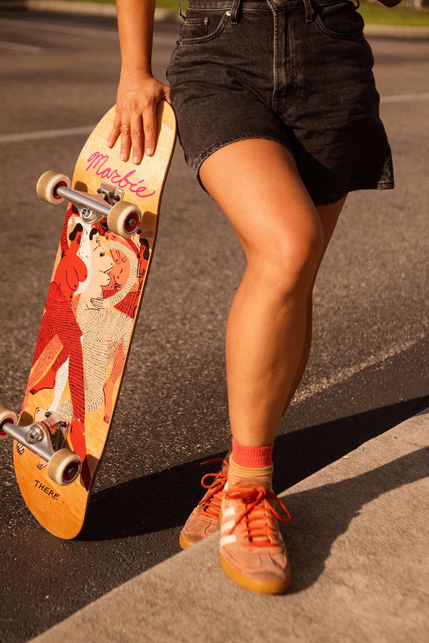 Close-up shots of orange sneakers and a skateboard deck with red artwork.