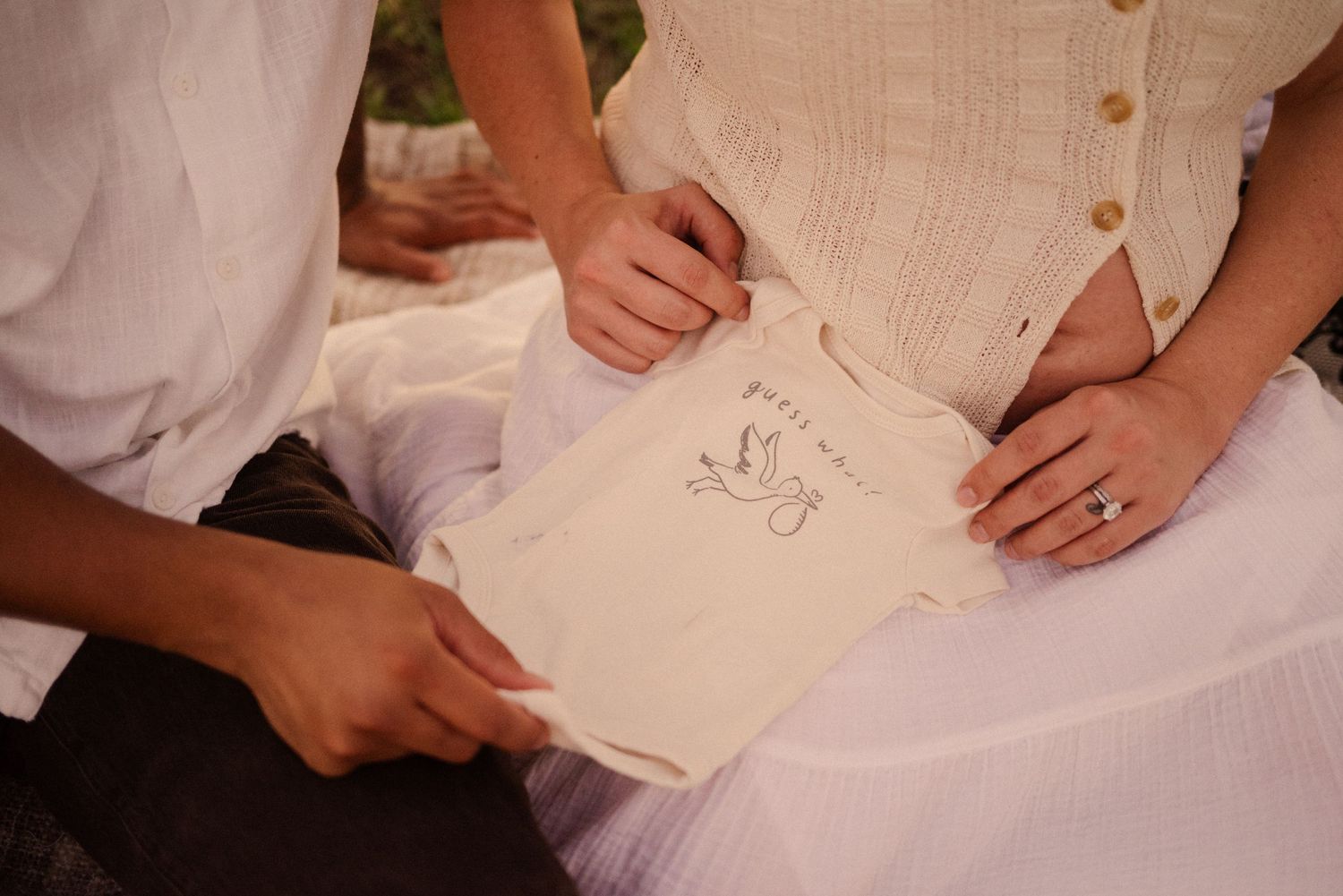 Close-up view of hands writing or signing on paper documents.