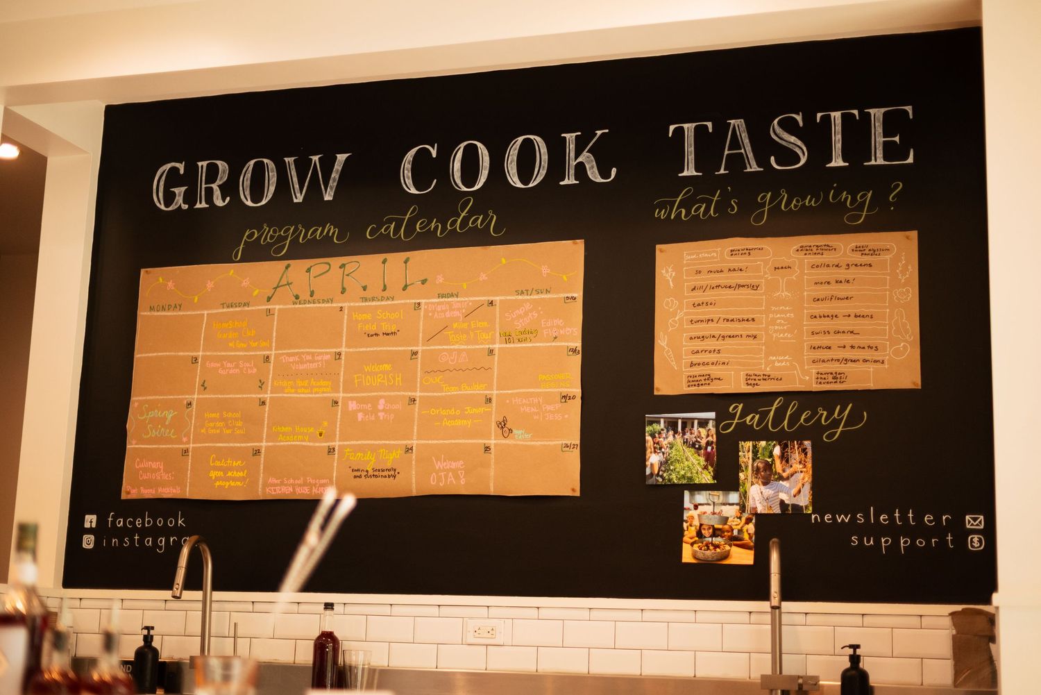 Chalkboard wall calendar displaying 'Grow Cook Taste' with monthly schedule and menu items.