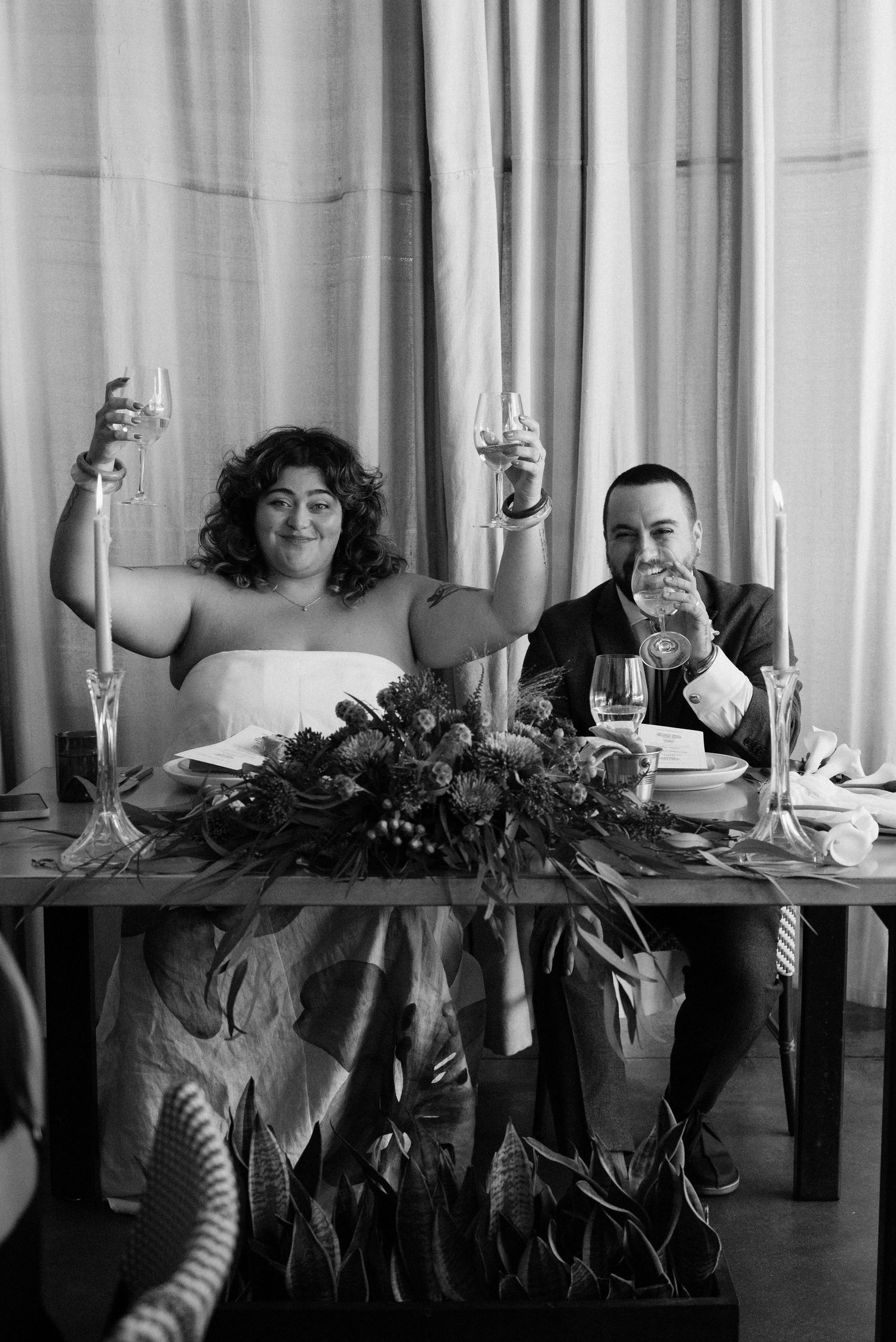 Black and white sequence showing playful expressions across a dining table.