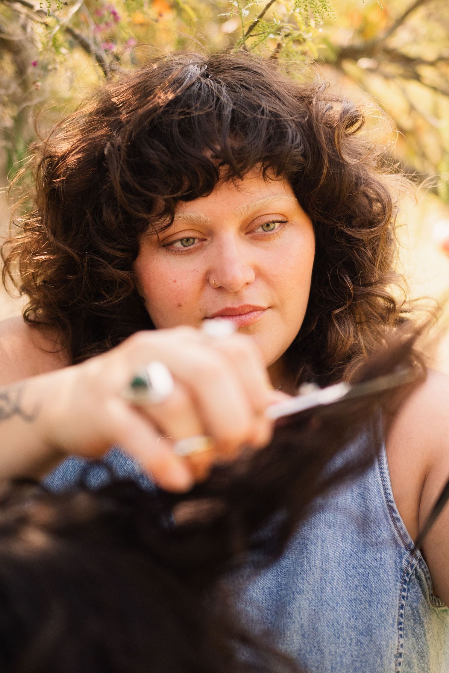 Close-up portrait series showing curly dark hair and natural lighting against a warm autumn background.