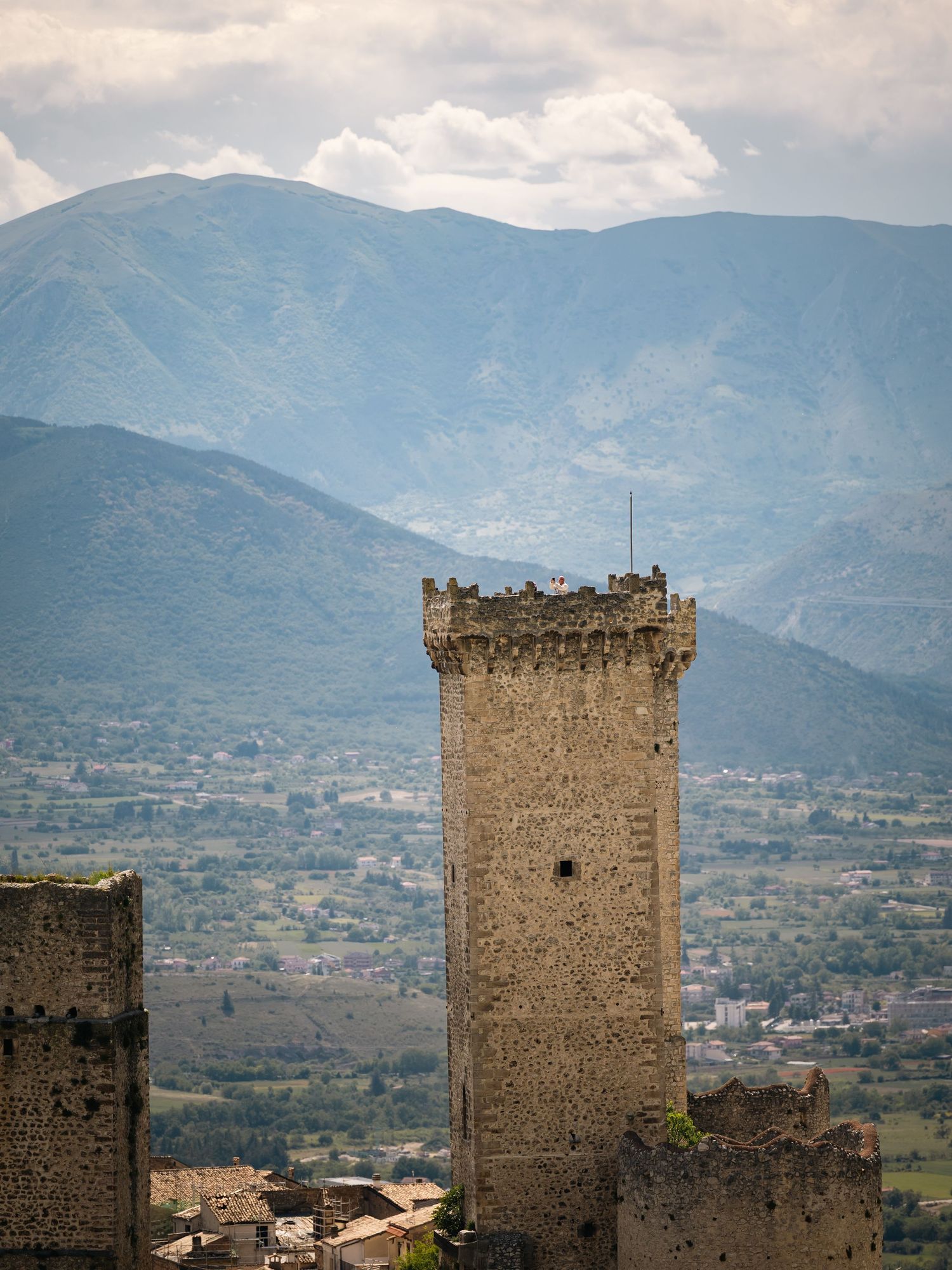PACENTRO - Man taking a photo at the top of a castle