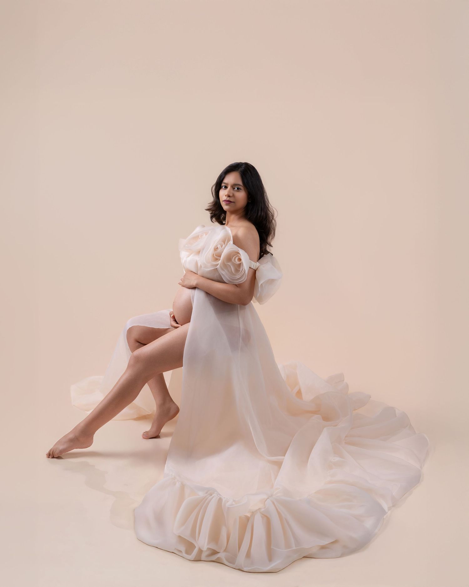 Elegant maternity portrait in a white gown at Suvira Clicks studio in Sultan, WA