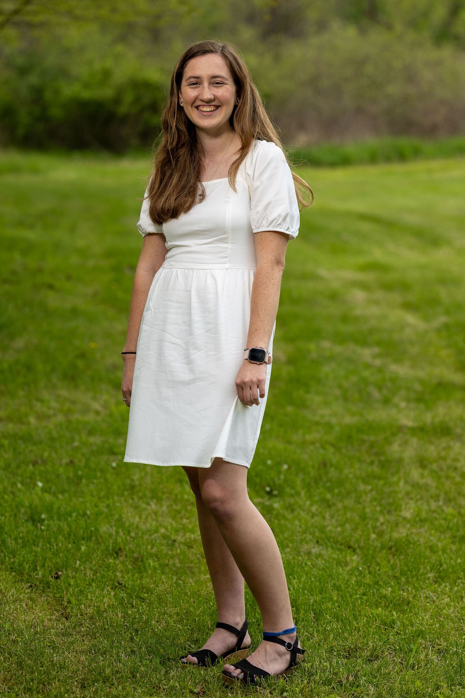 A happy senior during a golden hour photography session.
