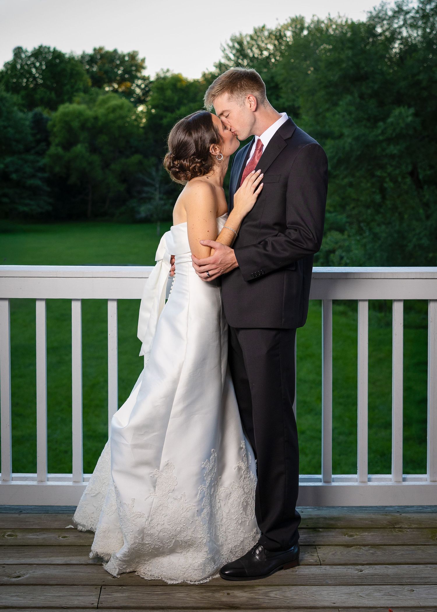 Bride and groom taking bridal portraits after the Sacrament of Holy Matrimony at a Catholic church.