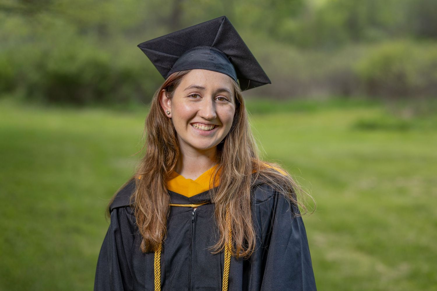 A happy senior during a golden hour photography session.
