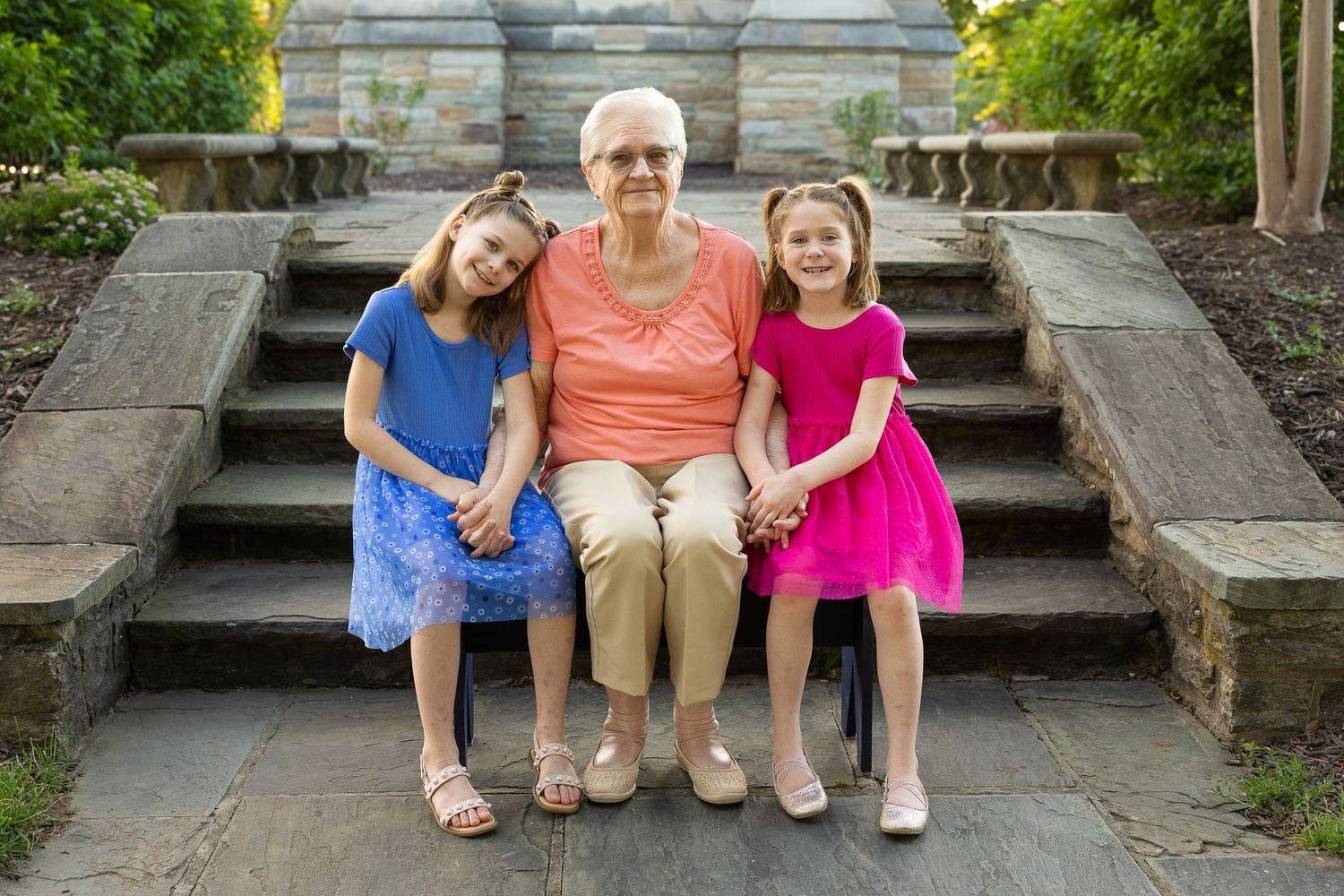 A happy family sitting together during a golden hour photography session.