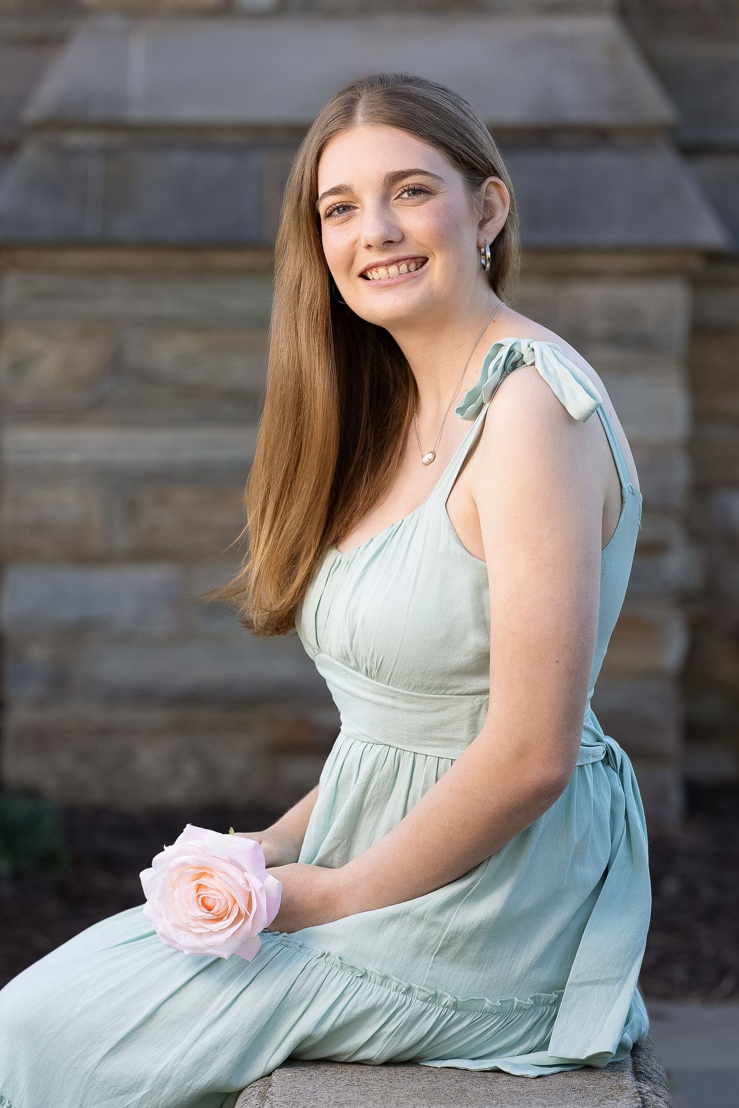 A happy senior during a golden hour photography session.