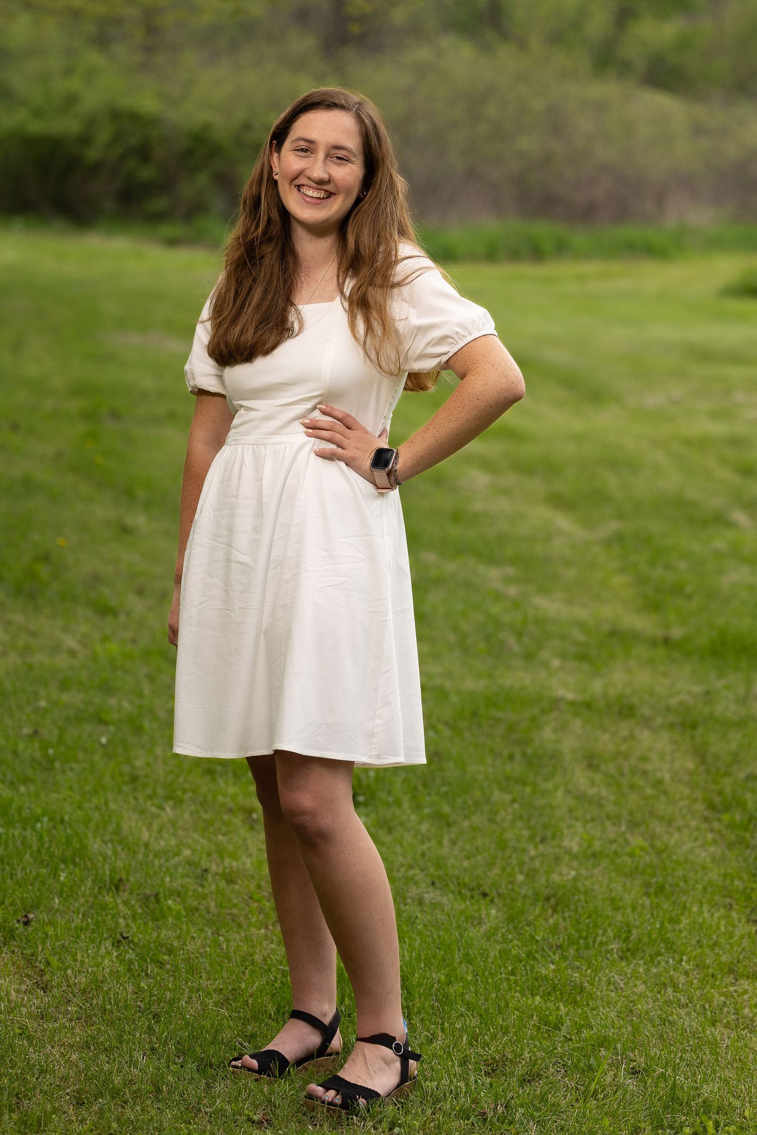 A happy senior during a golden hour photography session.