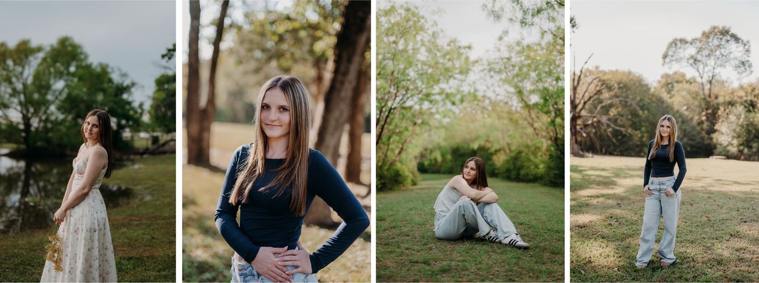 Young woman standing outdoors near trees, smiling, wearing a long-sleeved black top and light-colored jeans for senior photos.