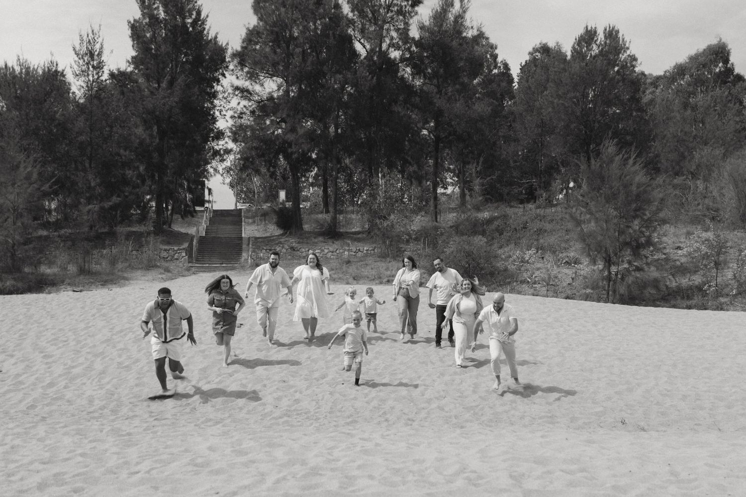 Family running on the beach