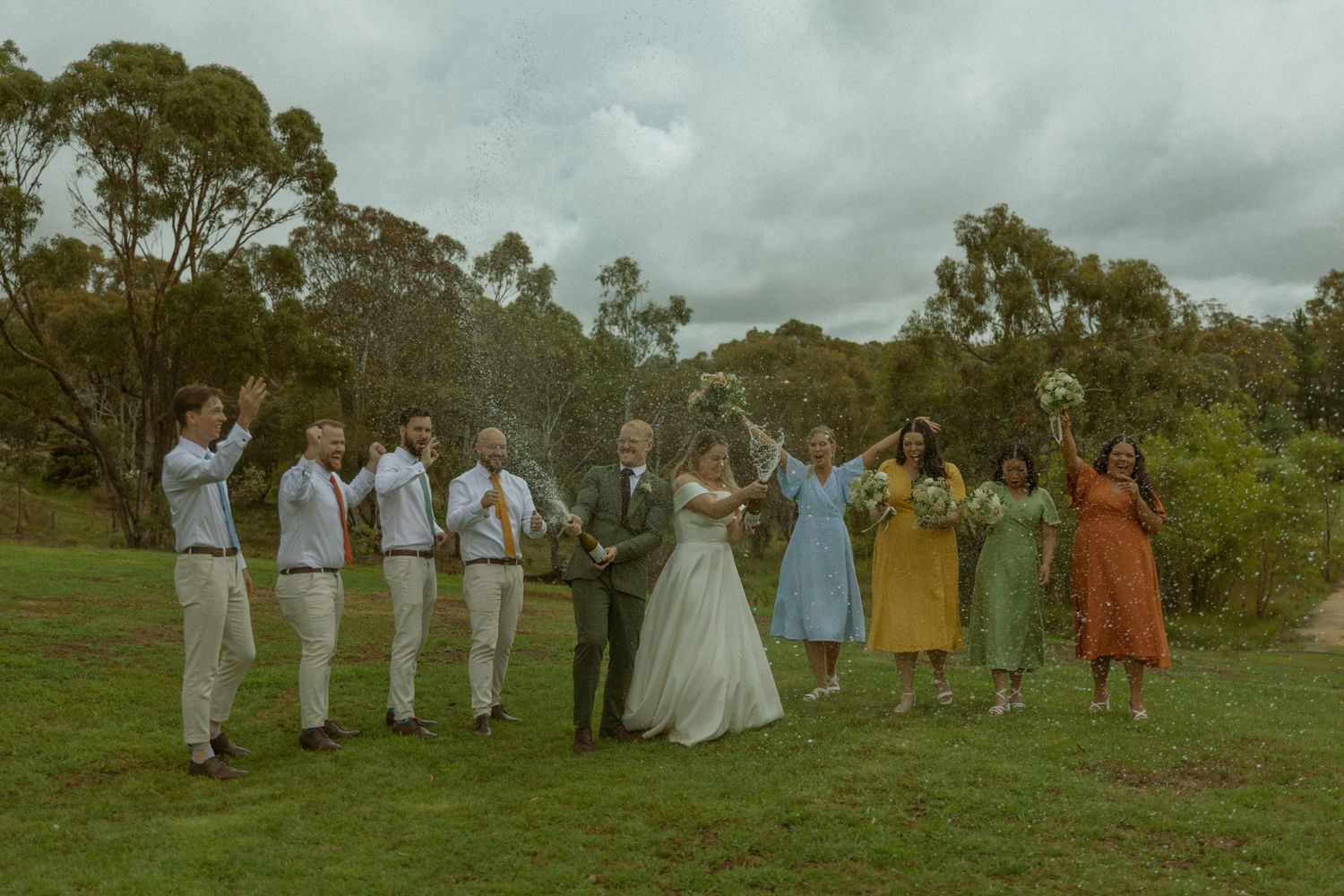Bride and Groom and Bridal Party enjoying champagne