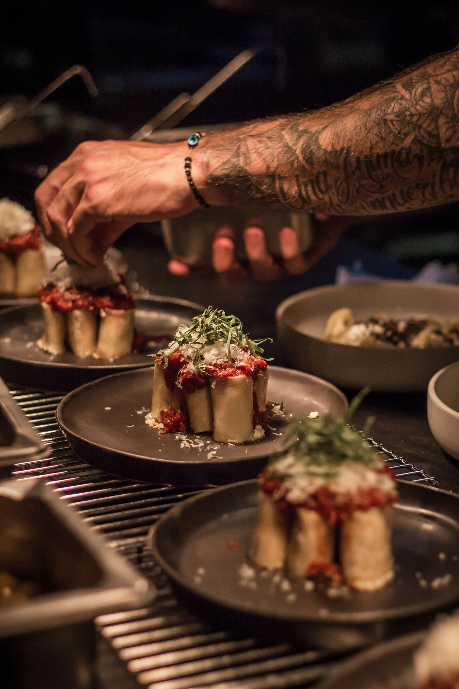 Chef plating a beautifully presented dish during a restaurant dining event in Cape Town, captured through food and event photography.