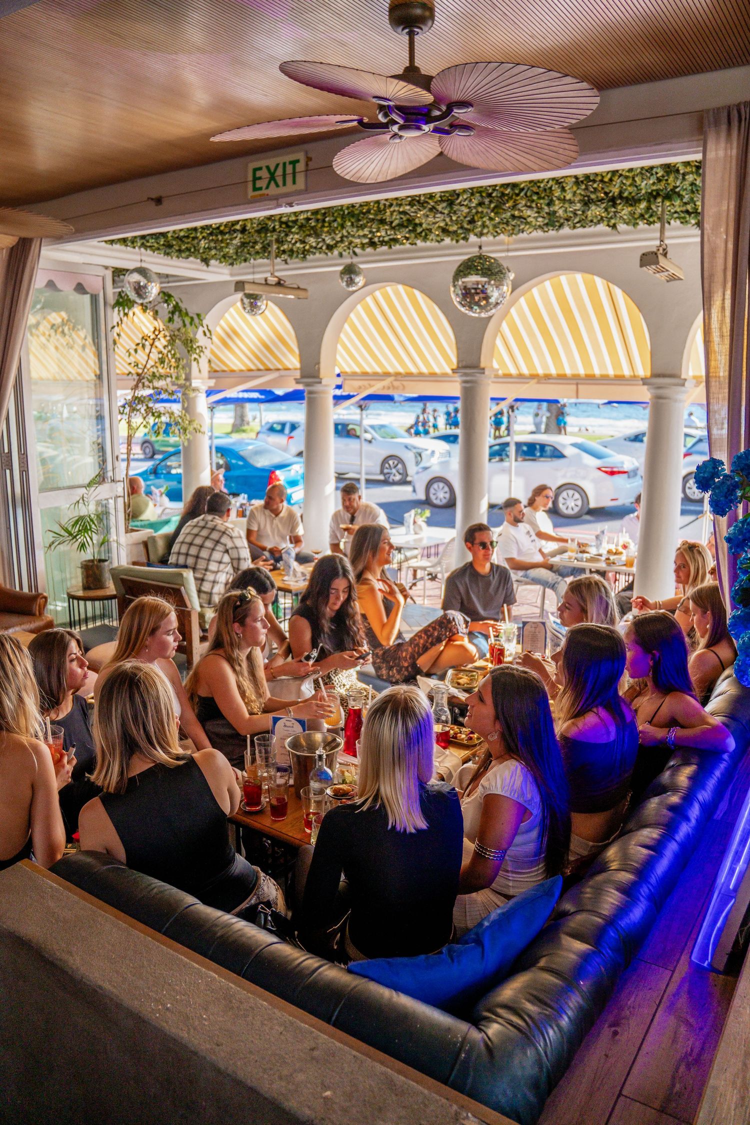 Guests enjoying a lively brunch event at a Cape Town restaurant, captured through candid event and lifestyle photography.