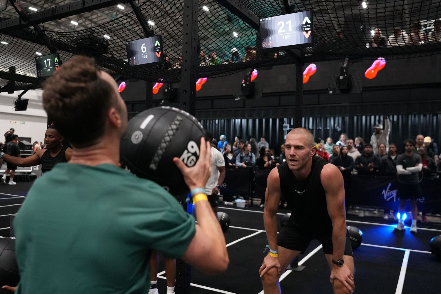 Male athlete competing in the wall ball station at HYROX Cape Town, captured through professional sports and fitness photography.
