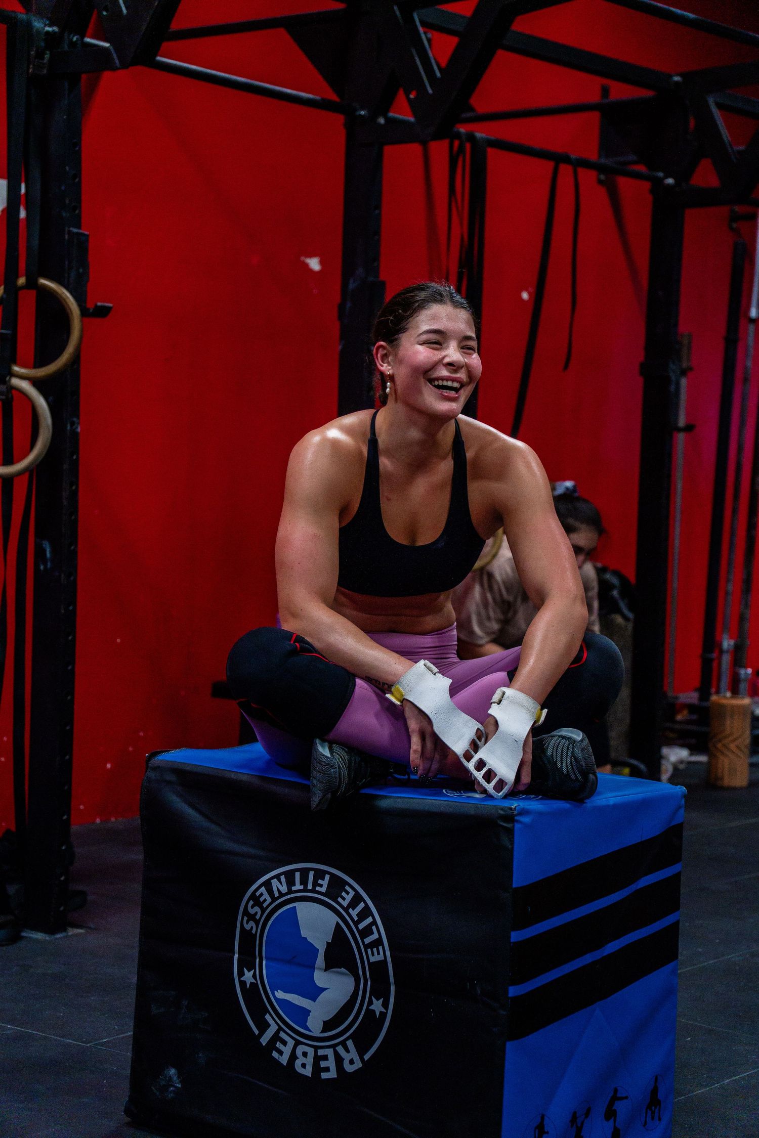 Female athlete during a functional fitness workout at a Cape Town gym, captured through professional fitness photography.