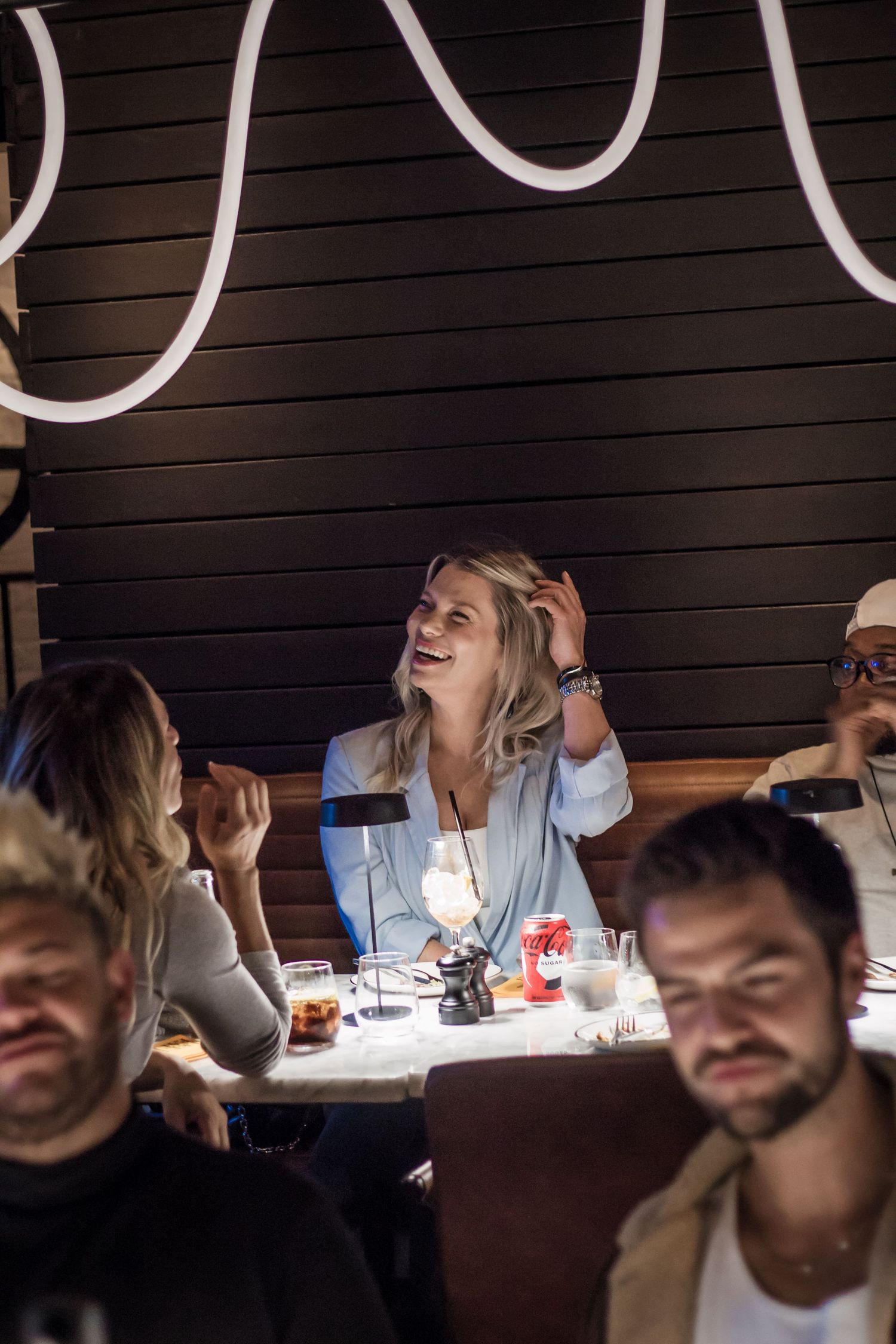 Guests enjoying an intimate evening dining experience during a restaurant event in Cape Town, photographed by Charlene Vrey Photography.