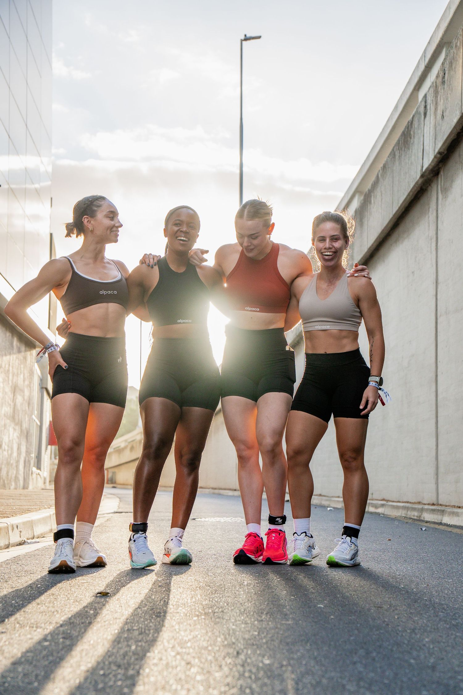 HYROX relay team posing together after an outdoor training session in Cape Town, captured through fitness photography.