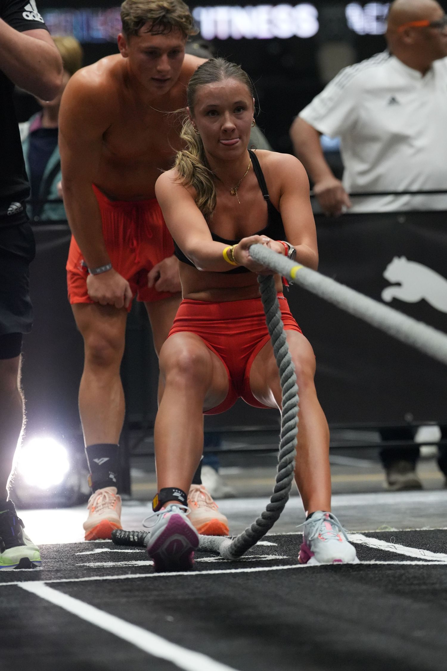 Female HYROX athlete competing during a functional fitness race, captured in action by sports photographer Charlene Vrey.