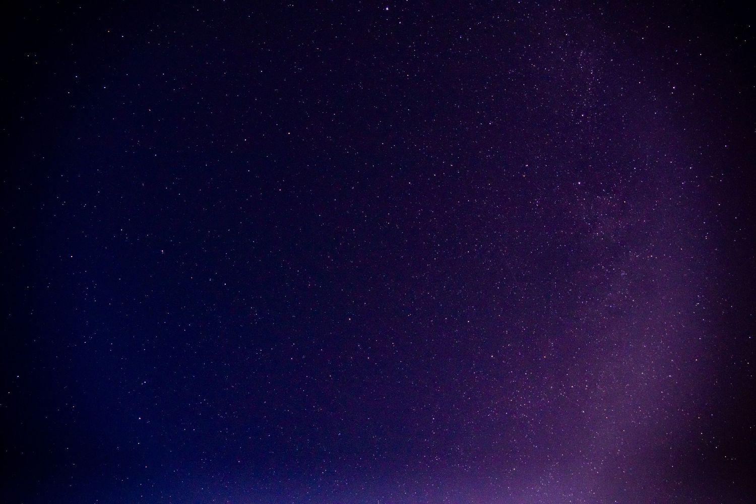 A picture of the stars with a purple hue