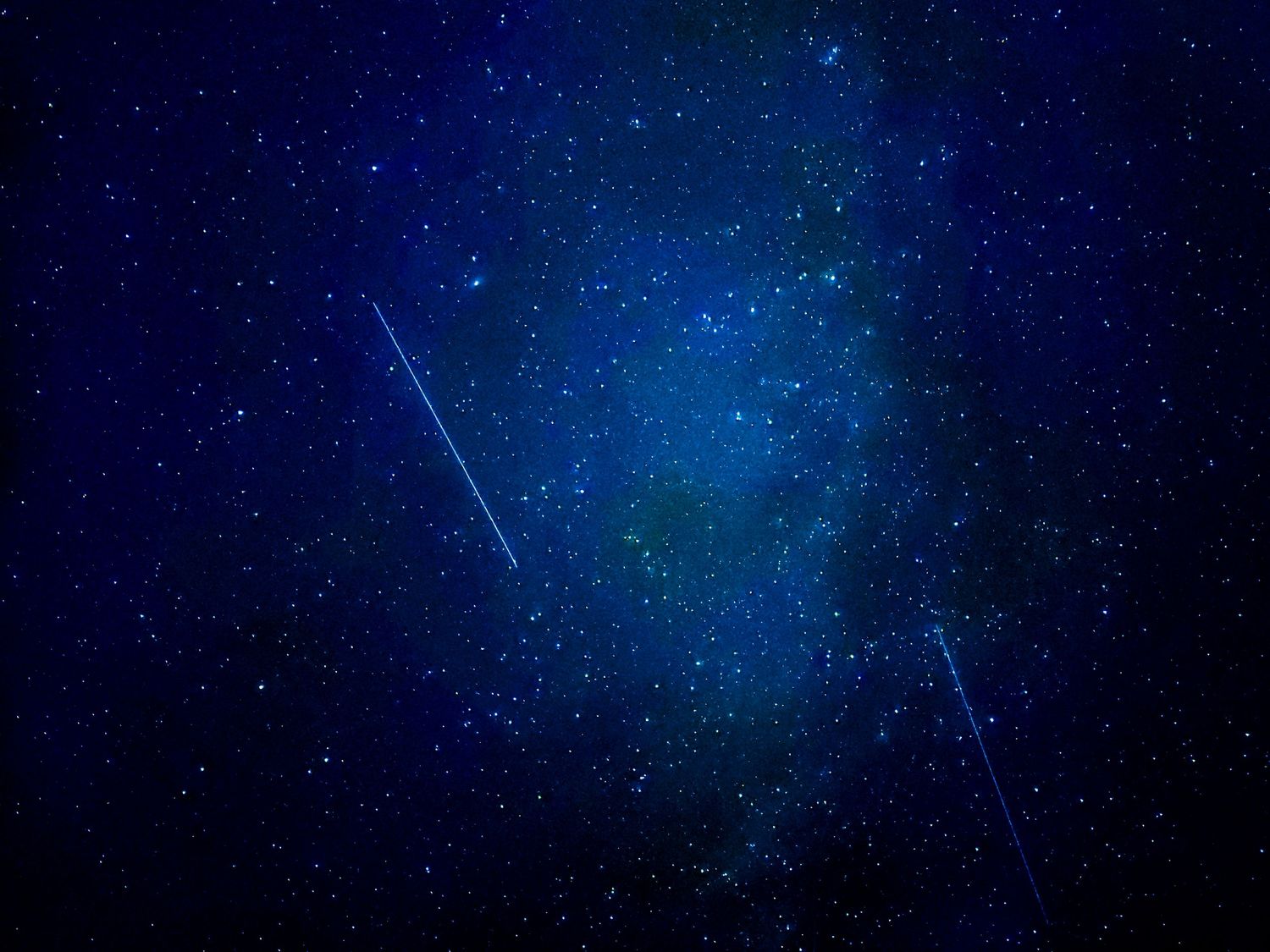 A picture of the stars with some satellites