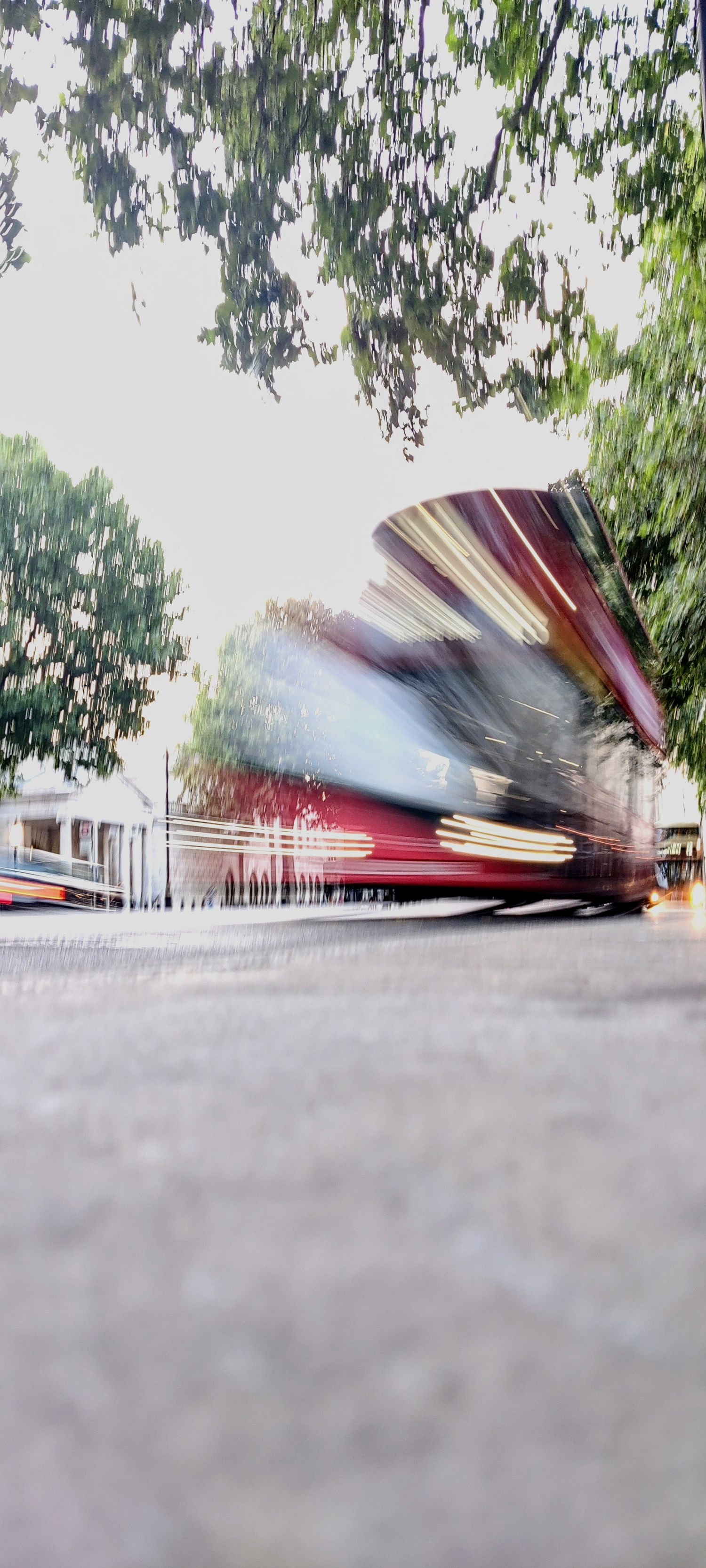 A London bus that is blurred in motion