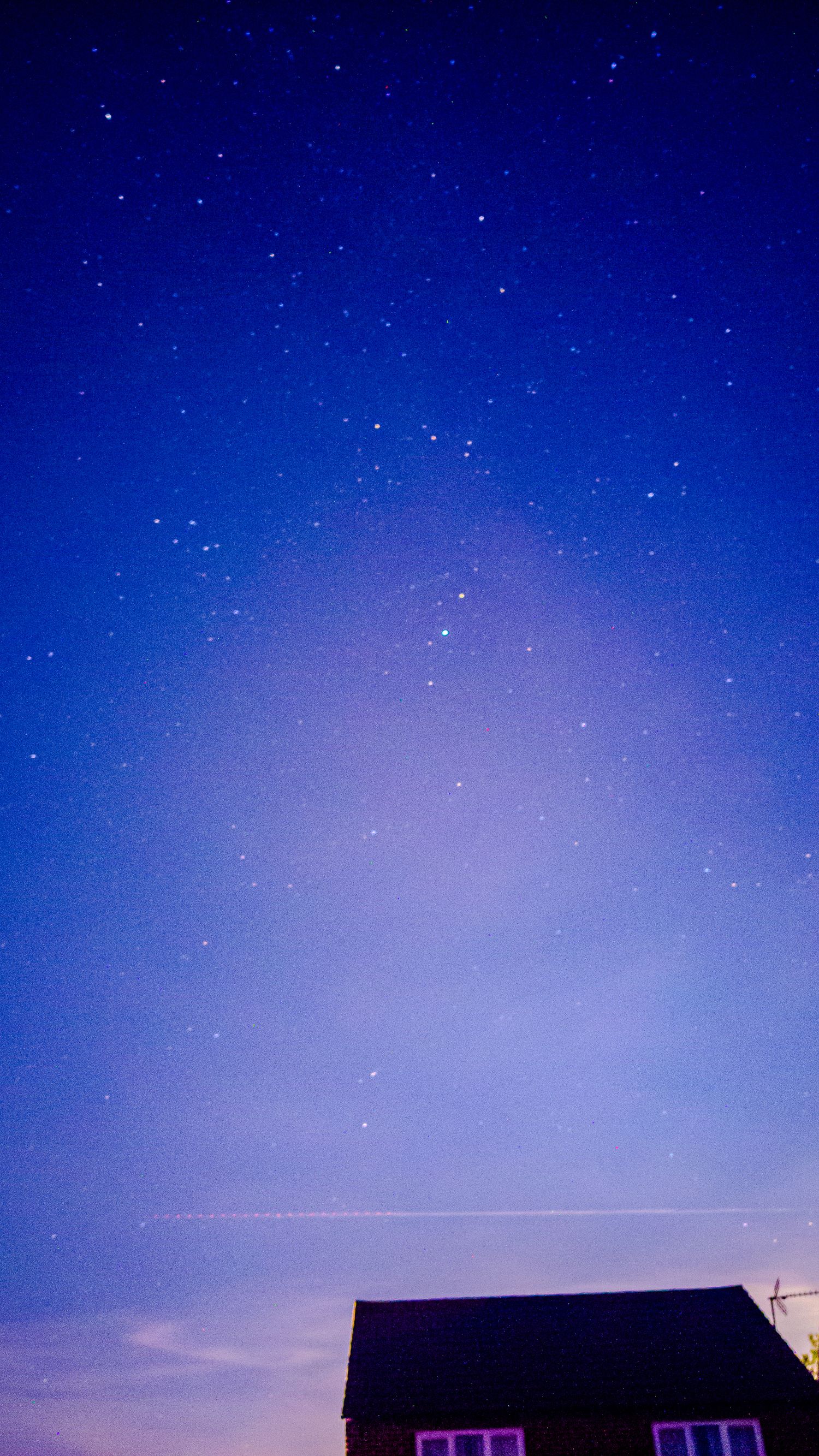 A picture of stars over a house