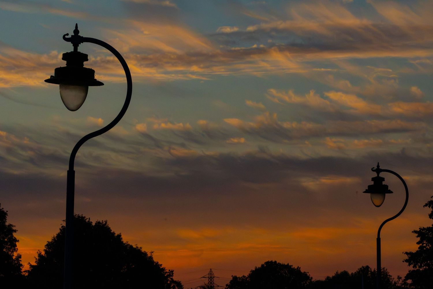 Street lights with a sunset background