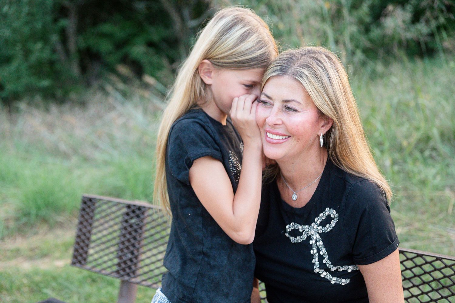Candid mother and daughter portrait at Chalco Hills Recreation Area in Omaha