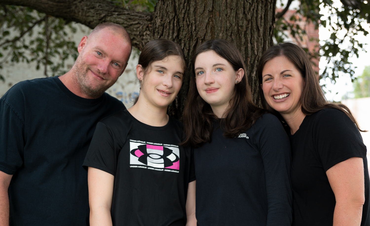 Outdoor family portrait with teenagers in downtown Gretna, Nebraska