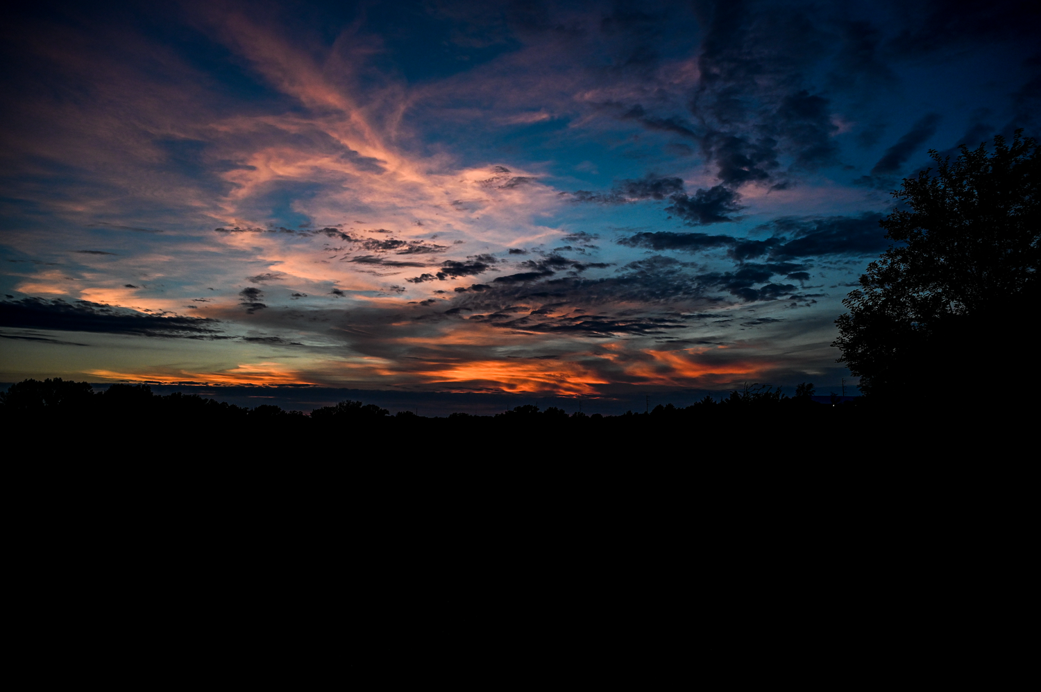 Colorful evening sunset over Chalco Hills Recreation Area in Omaha
