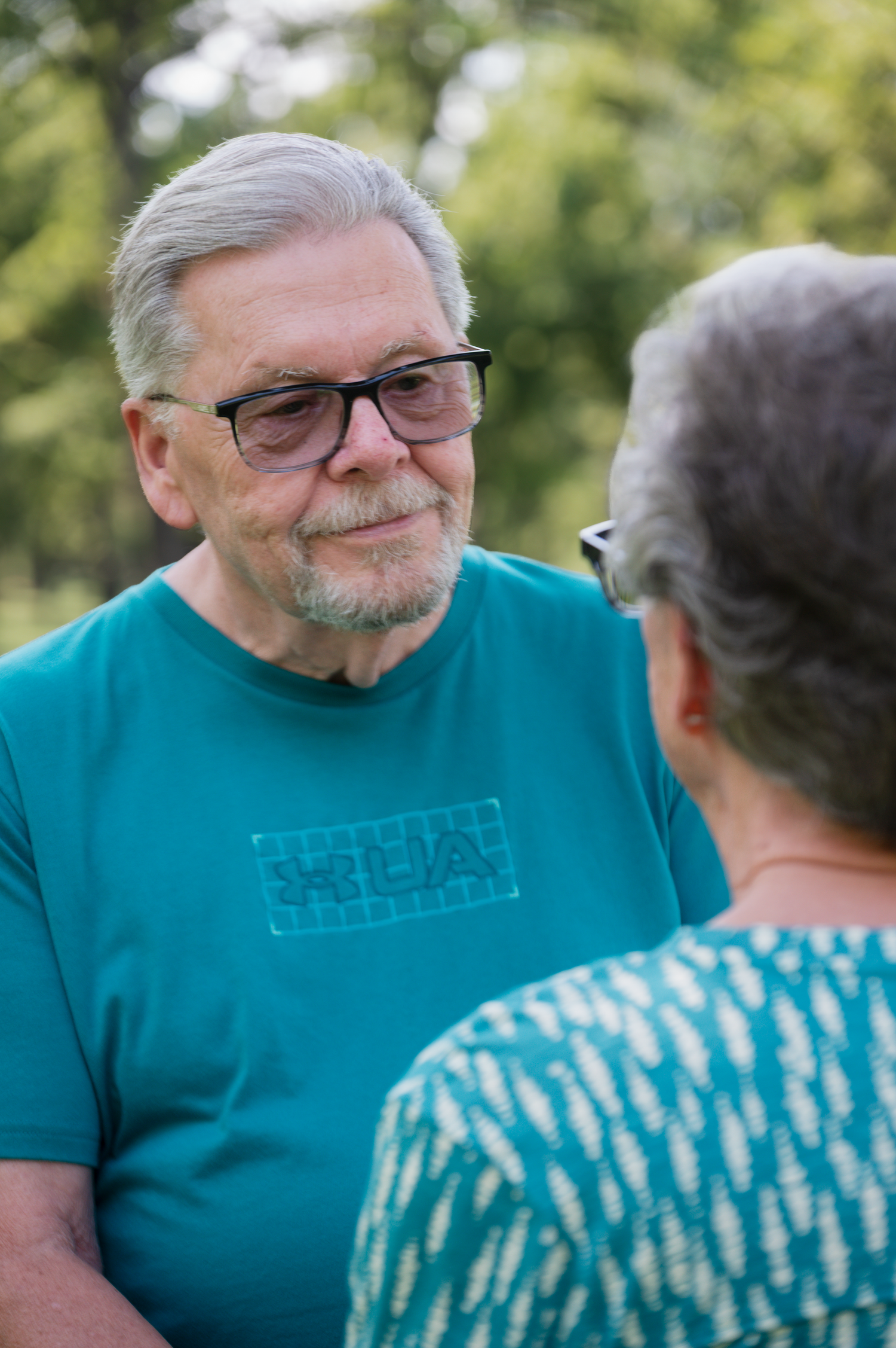 Candid anniversary portrait of a married couple at Walnut Grove Park in Omaha