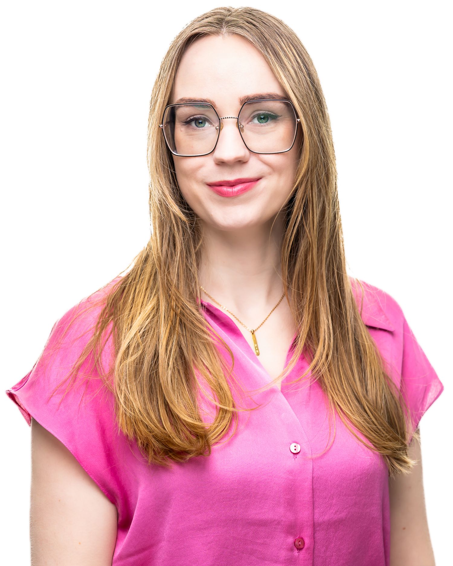 Portrait of someone wearing glasses and a bright pink button-up top with straight brown hair smiling at the camera.