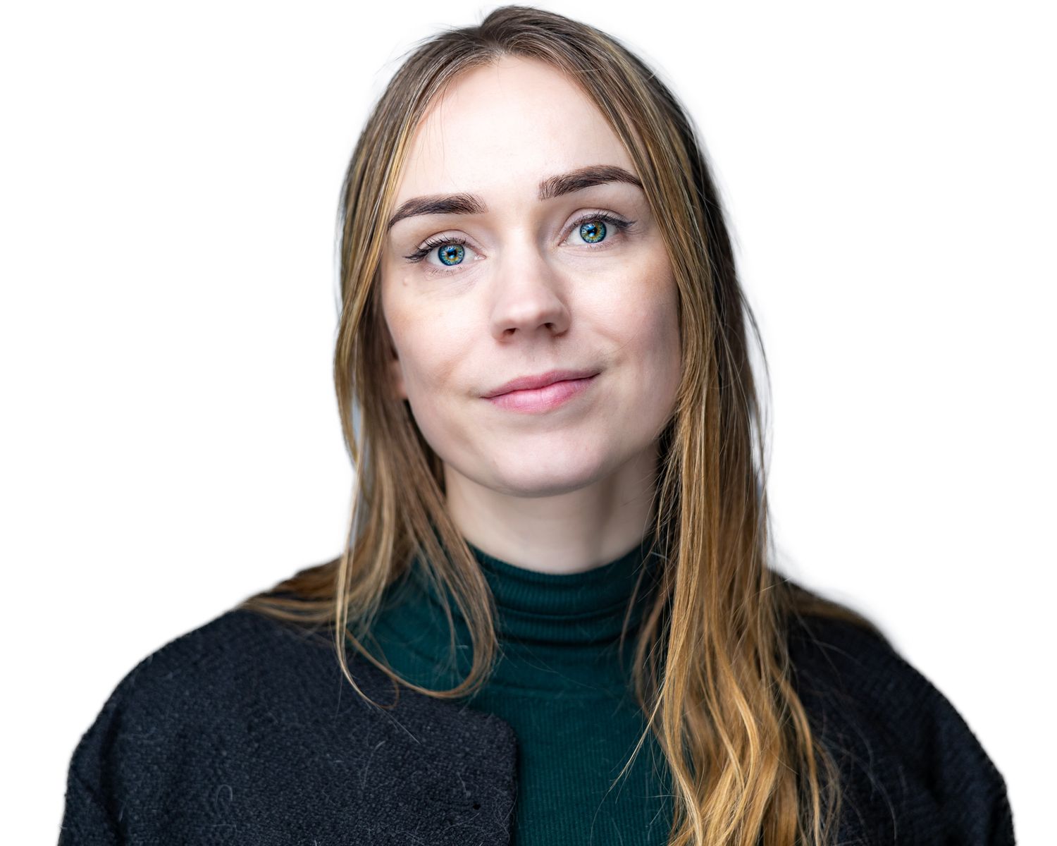 Professional studio portrait of someone in a green turtleneck and black sweater against a white background.