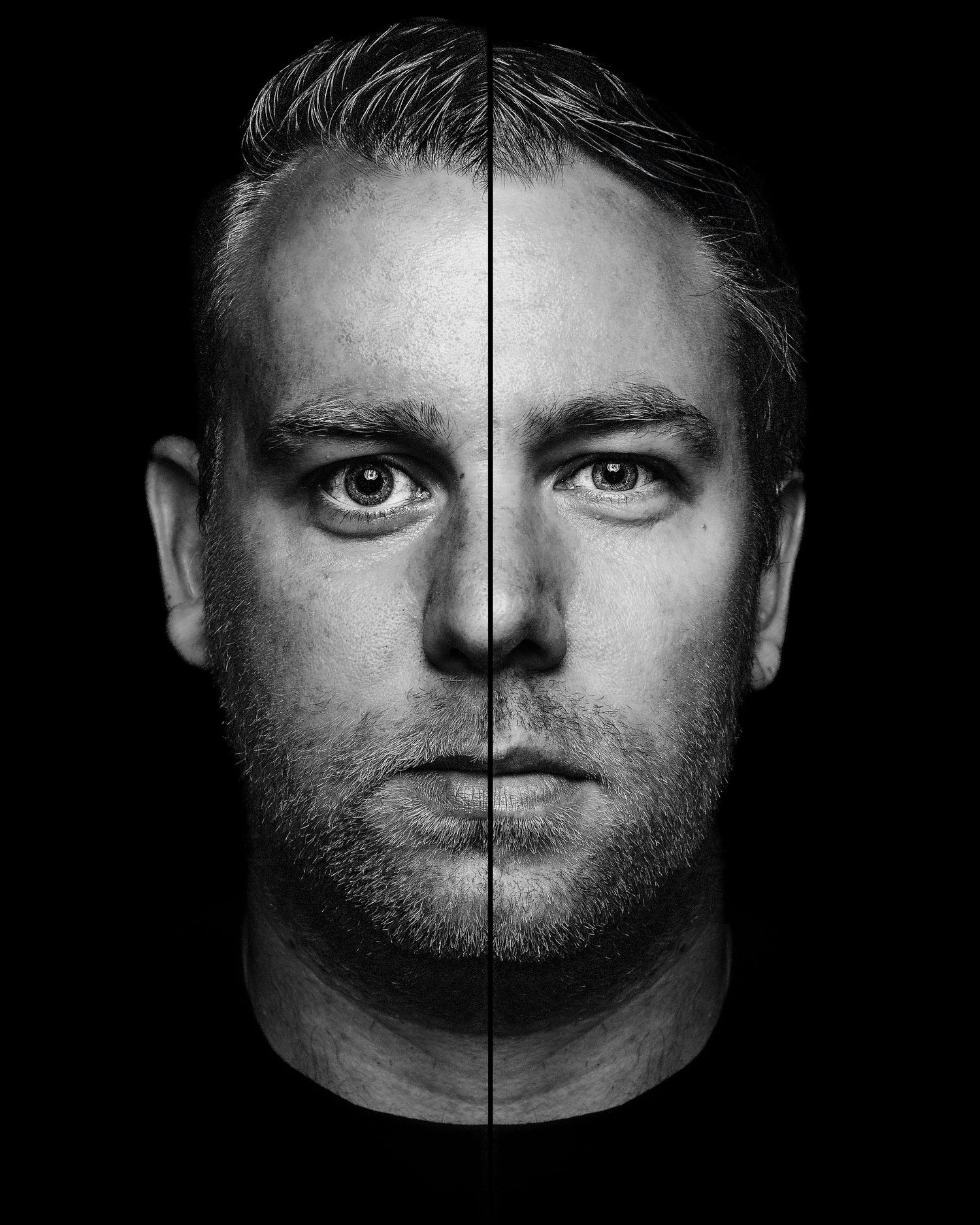 Dramatic black and white portrait split down the middle showing symmetrical facial features.

- BU Photography -