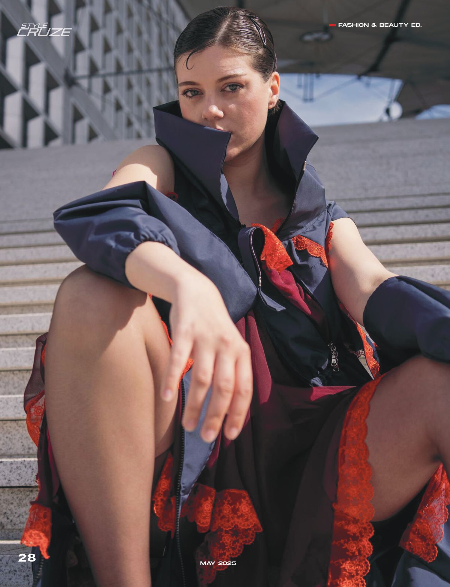 A person in a navy blue outfit with red accents sits on concrete steps in an artistic photo series.