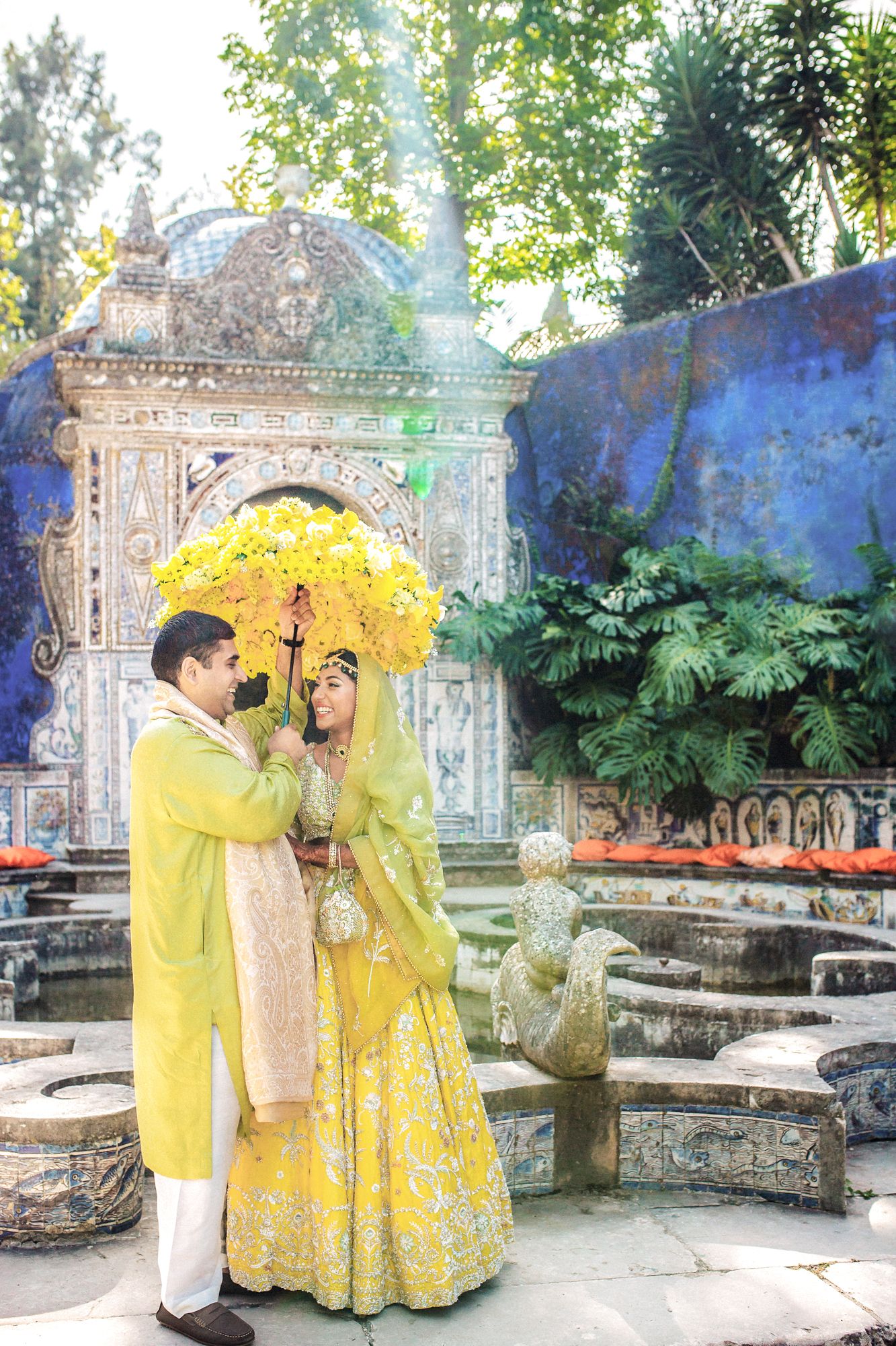 Bride & groom sharing a joyful moment, photographed by an Indian destination wedding photographer in Portugal – Fronteira Palace