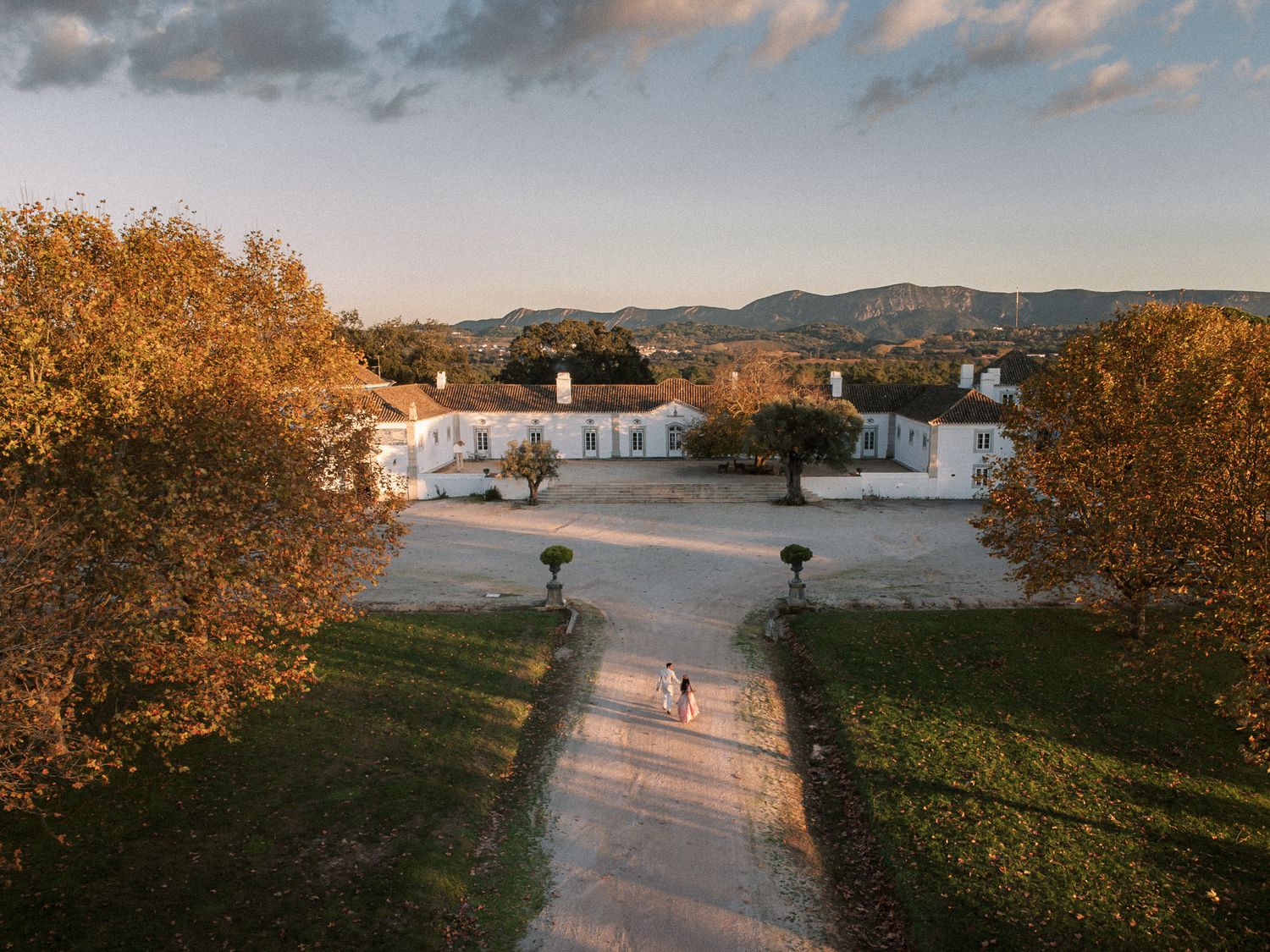 indian bride and groom at their wedding venue herdade do peru aerial photo from drone