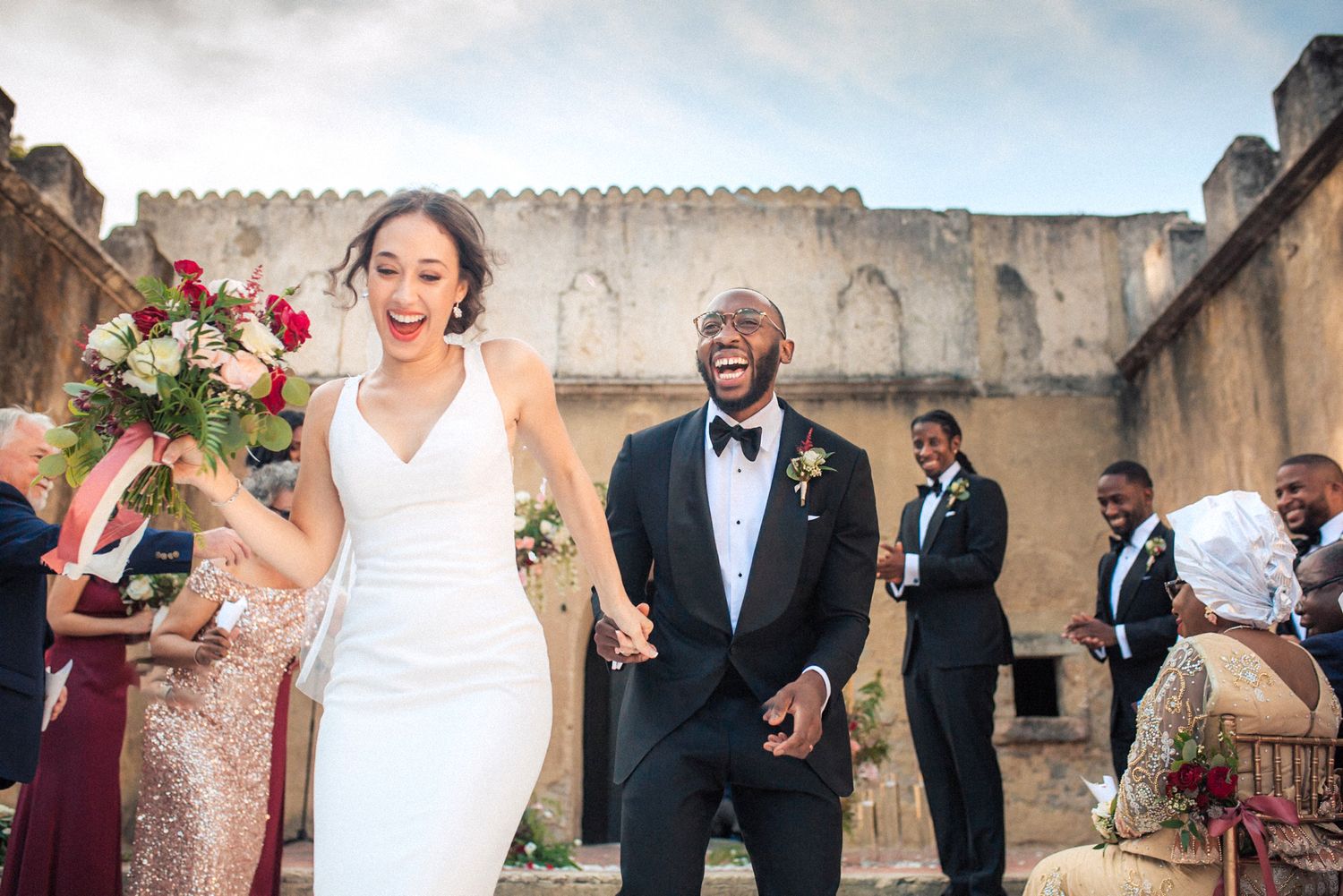 Afro American newlyweds exiting ceremony at Núncio Garden Penha Longa Resort in Portugal