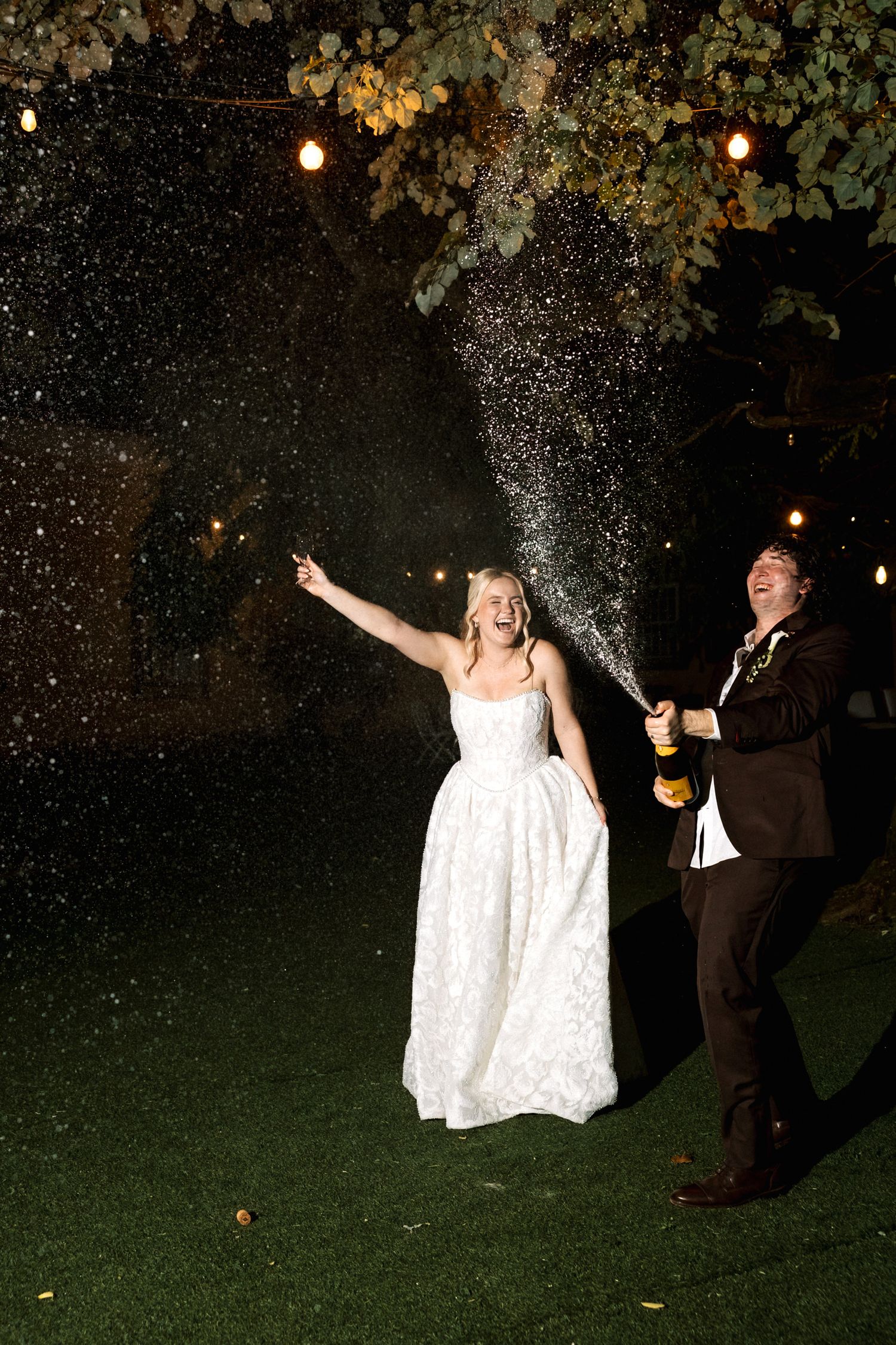 Cinematic night wedding portraits with champagne in Portugal
