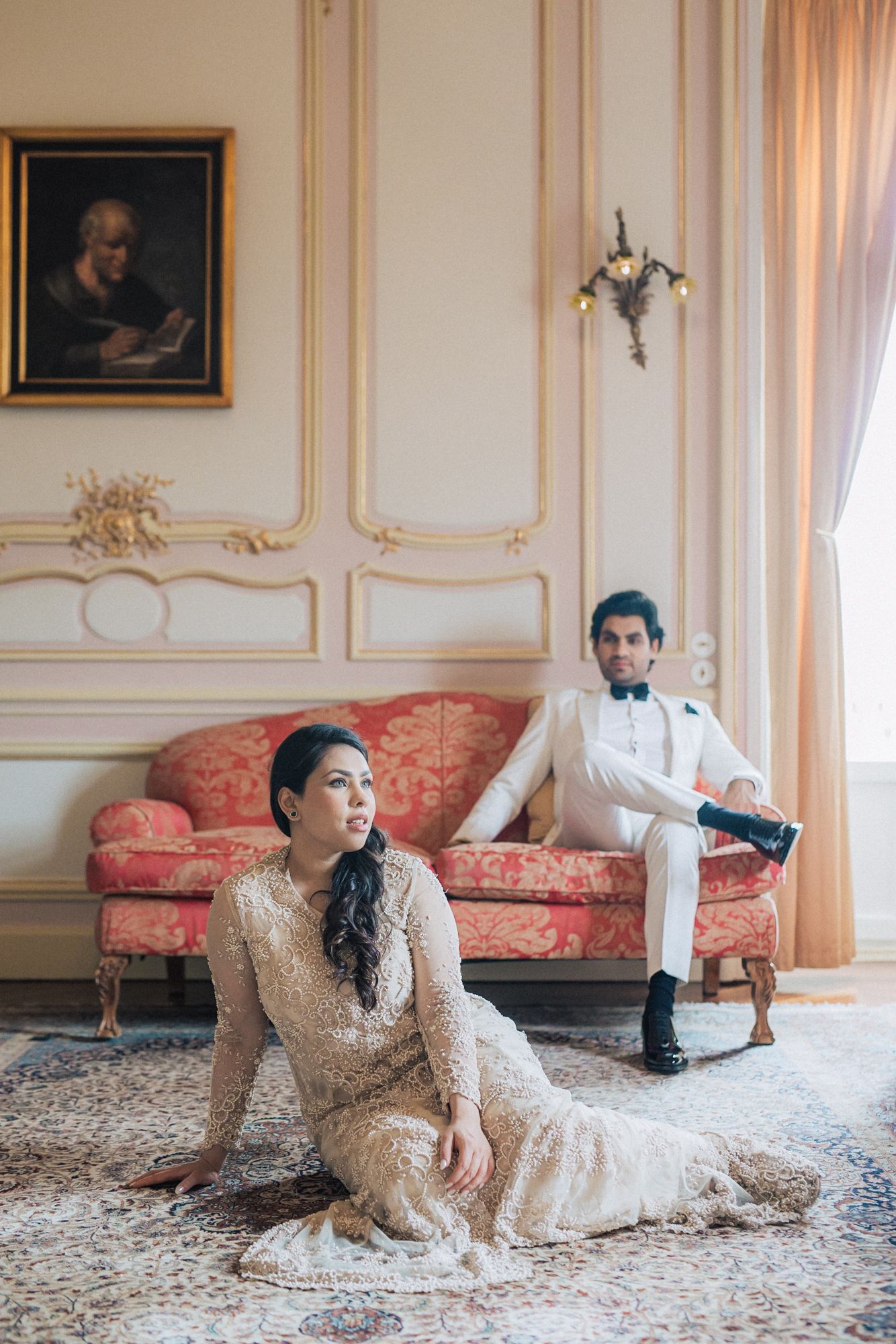 Romantic engagement photoshoot of a couple in an elegant attire pousing at Pestana palace in Lisbon during a Destination Wedding in Portugal