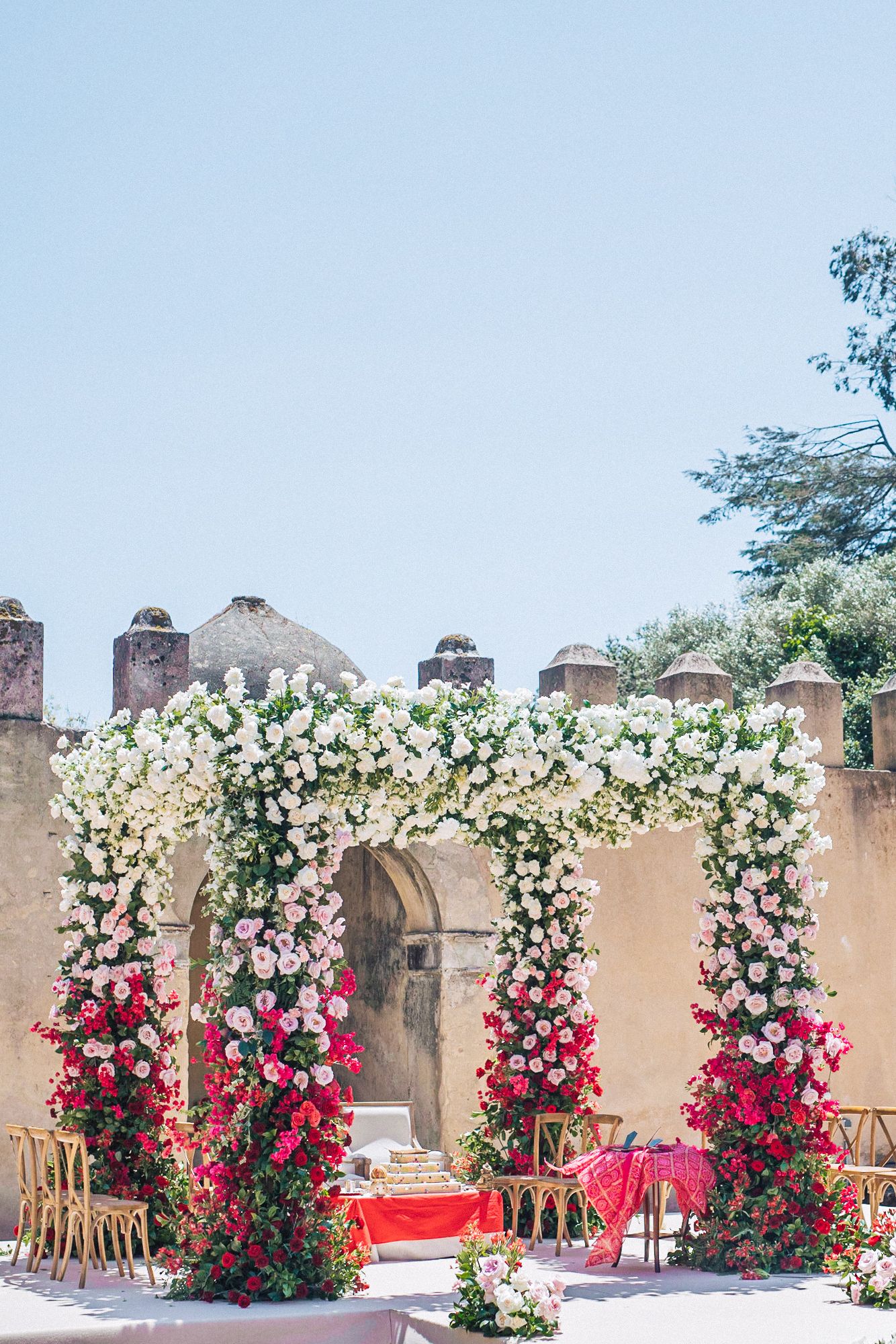 Exquisite wedding flowers adorn the mandap at a Destination Indian Wedding in Portugal, set in the stunning Nuncio Garden at Penha Longa