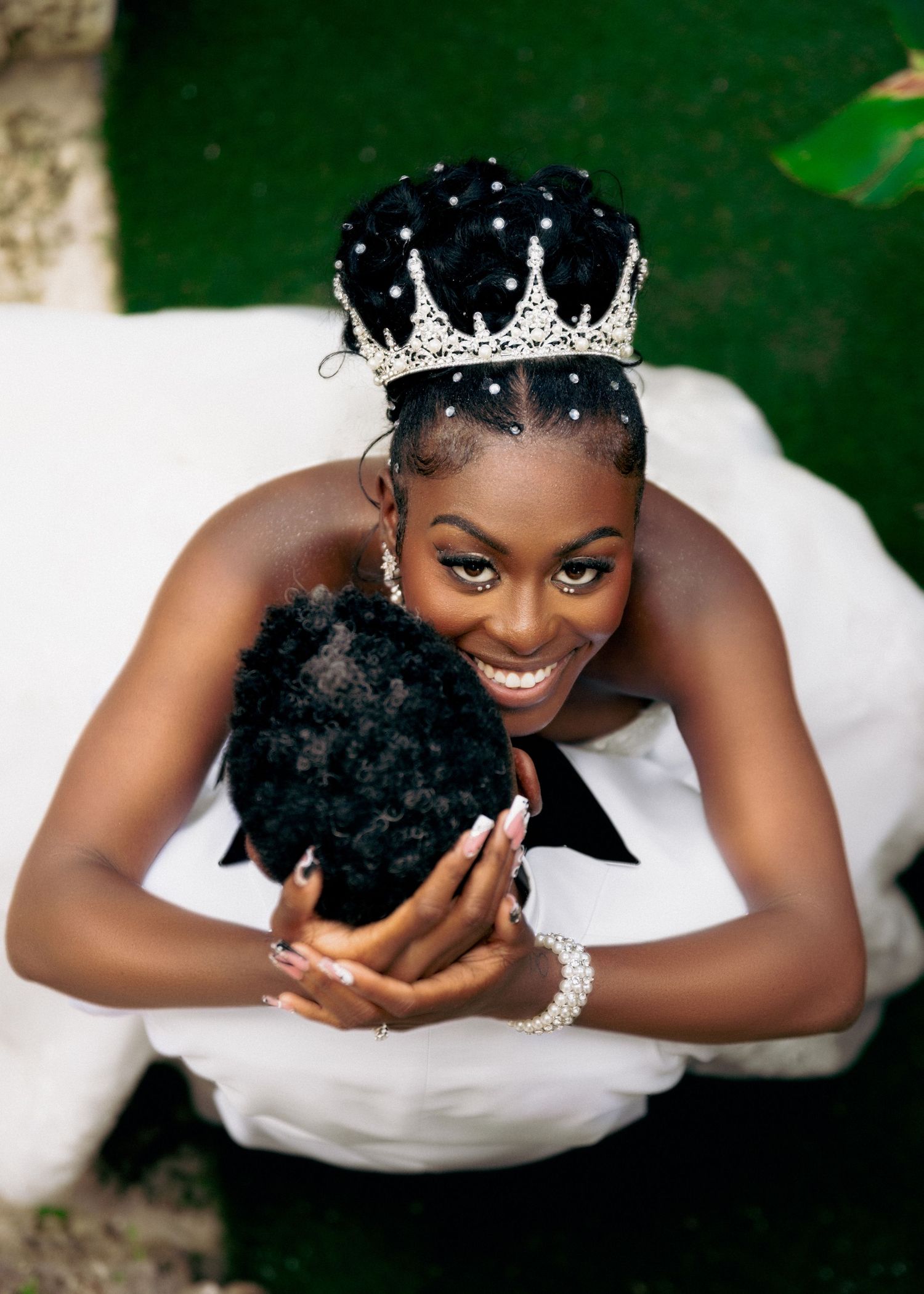 Elegant bridal portraits featuring a sparkling tiara and classic white gown.