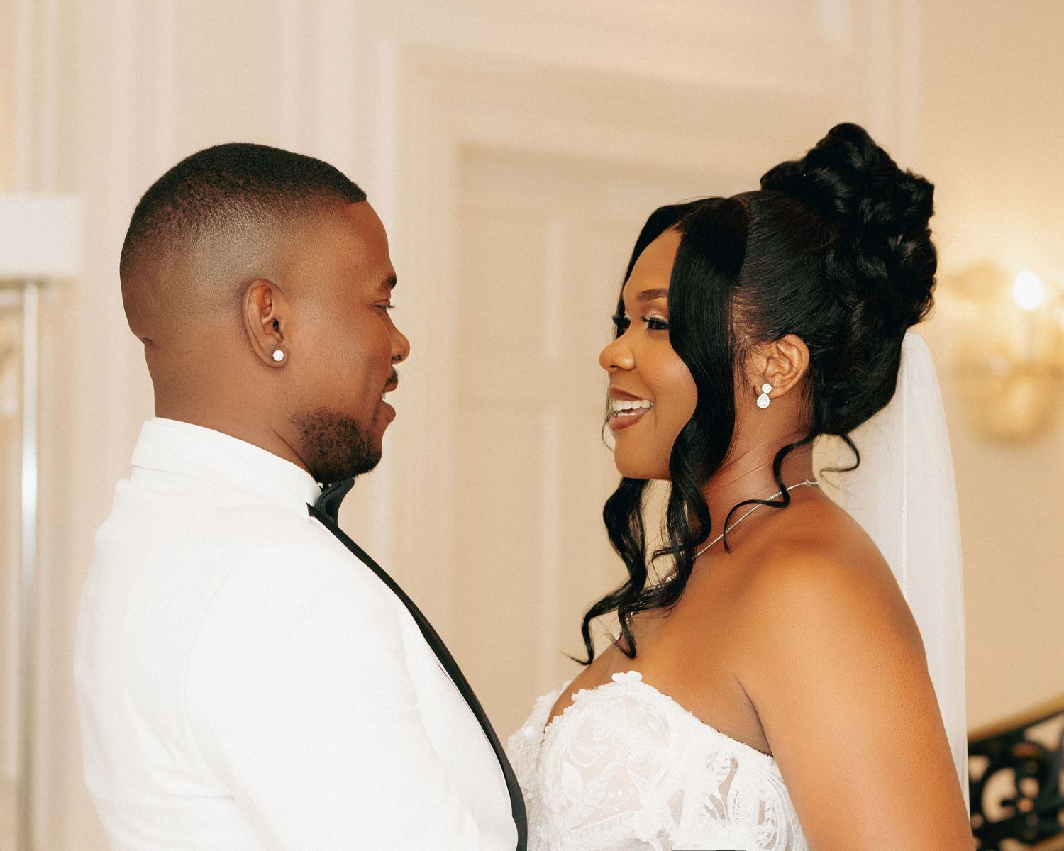 Intimate indoor wedding moments captured with warm lighting and elegant decor.