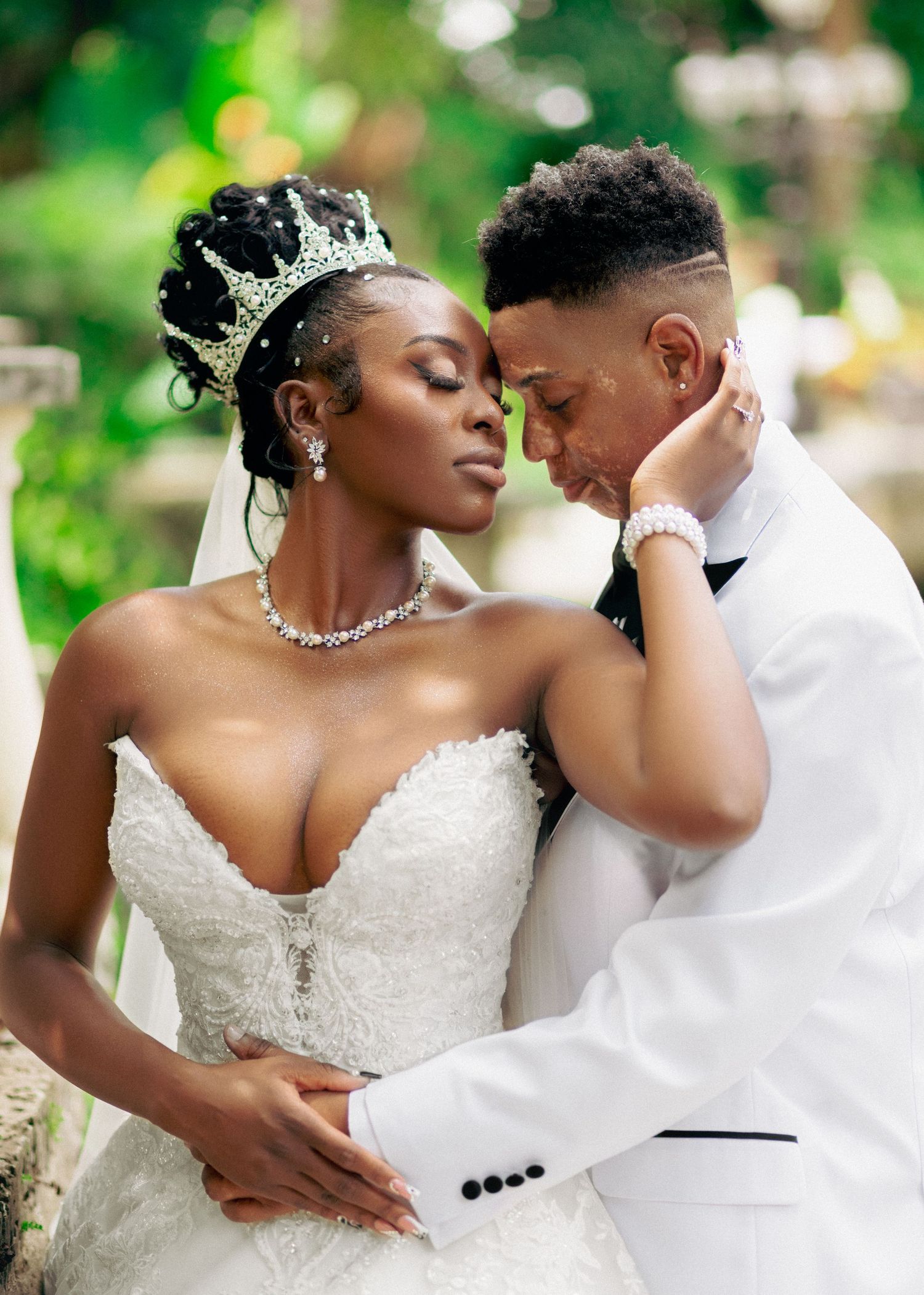 Romantic wedding portraits captured in a vibrant garden setting.