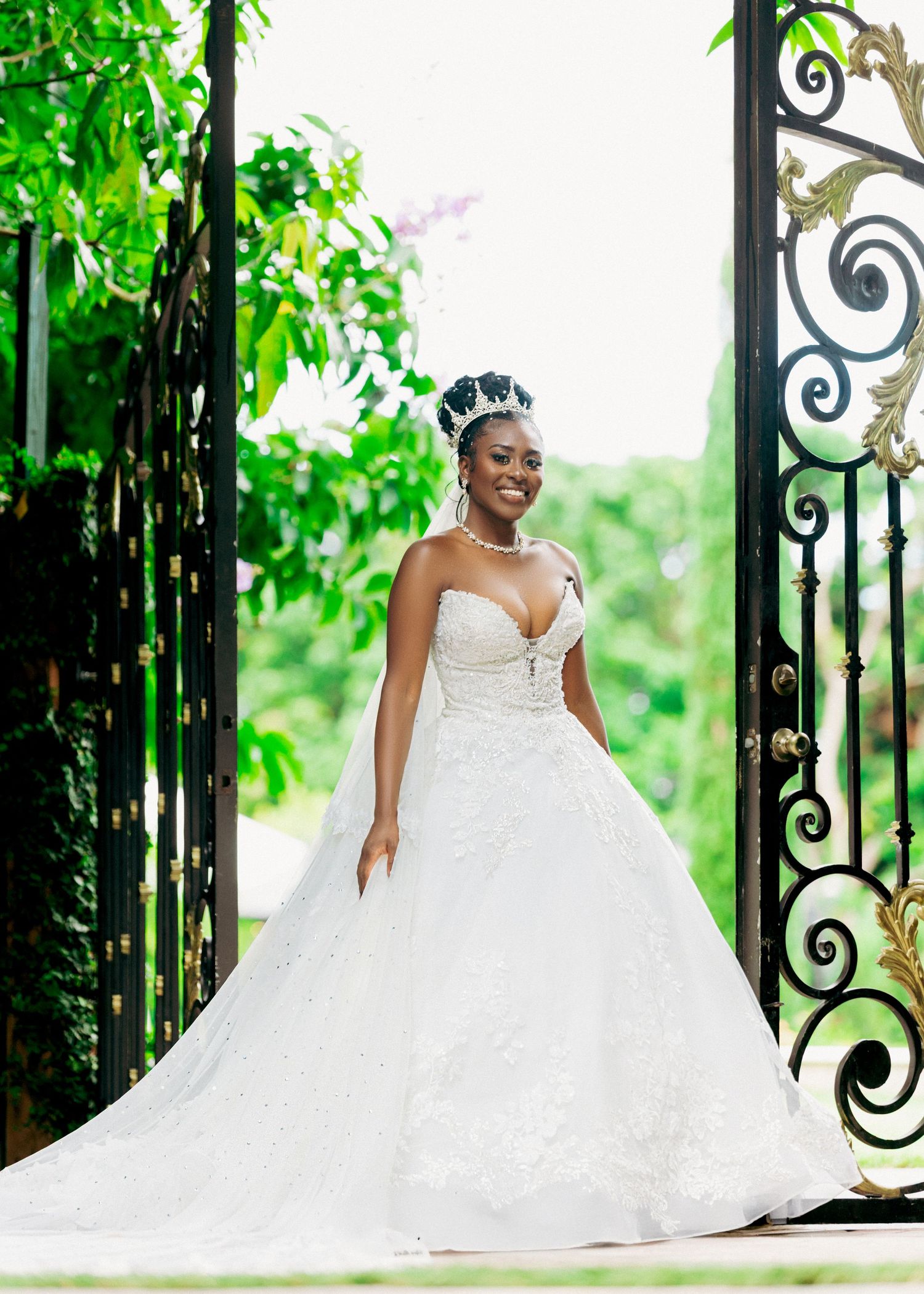Series of bridal portraits showcasing a stunning white ball gown against decorative garden gates.